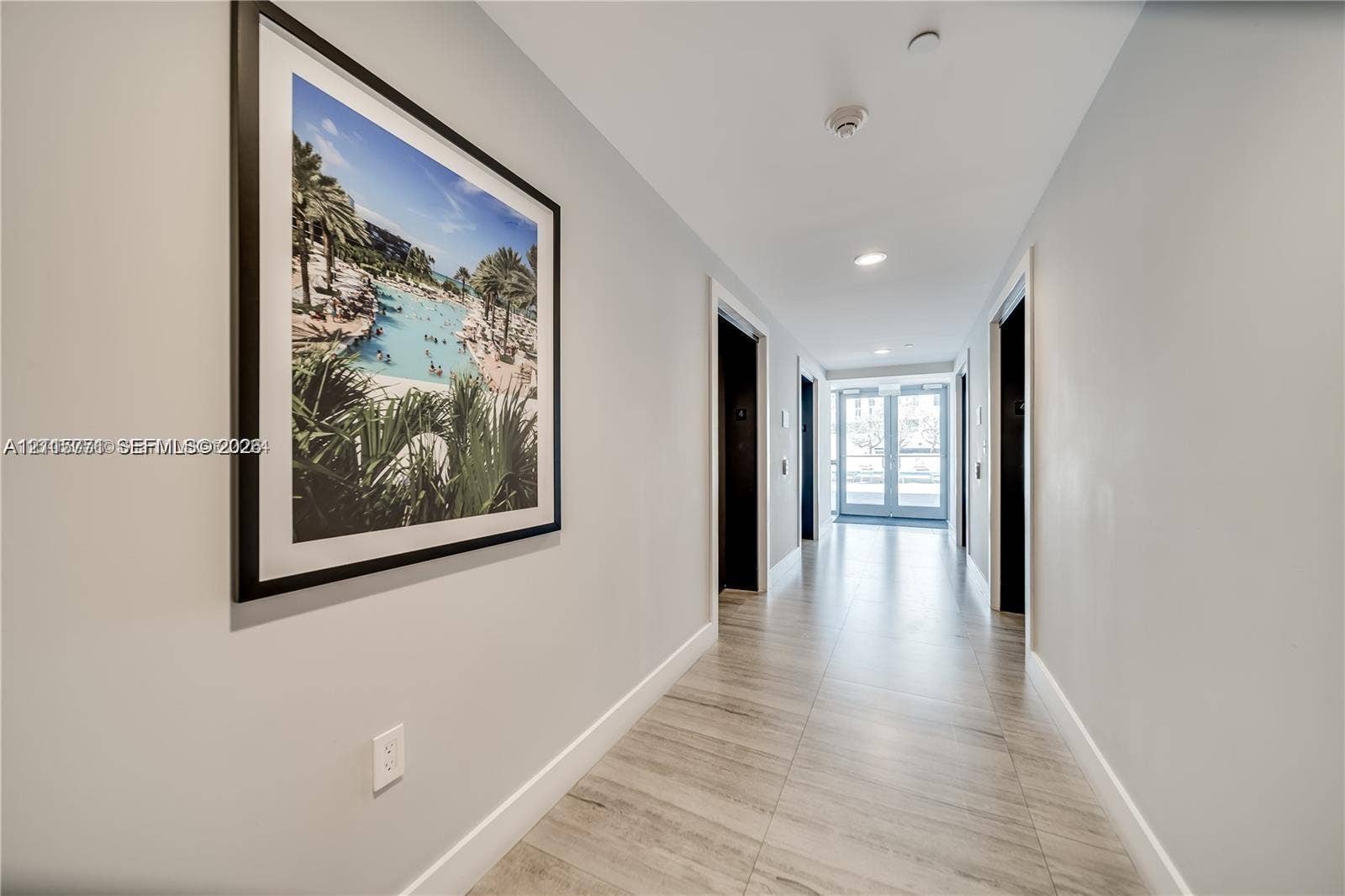 140 S Dixie Highway, #433, Hollywood, Hollywood, FL 33020 Hallway featuring wood-finish tile flooring, recessed ceiling lighting, and neutral wall tones