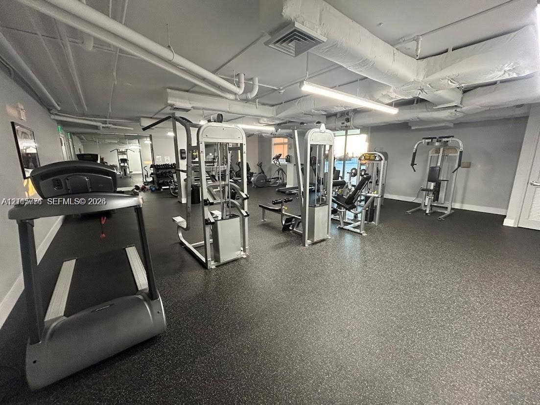 140 S Dixie Highway, #433, Hollywood, Hollywood, FL 33020 Fitness center featuring rubberized flooring, linear lighting, and an array of weight resistance and cardio equipment