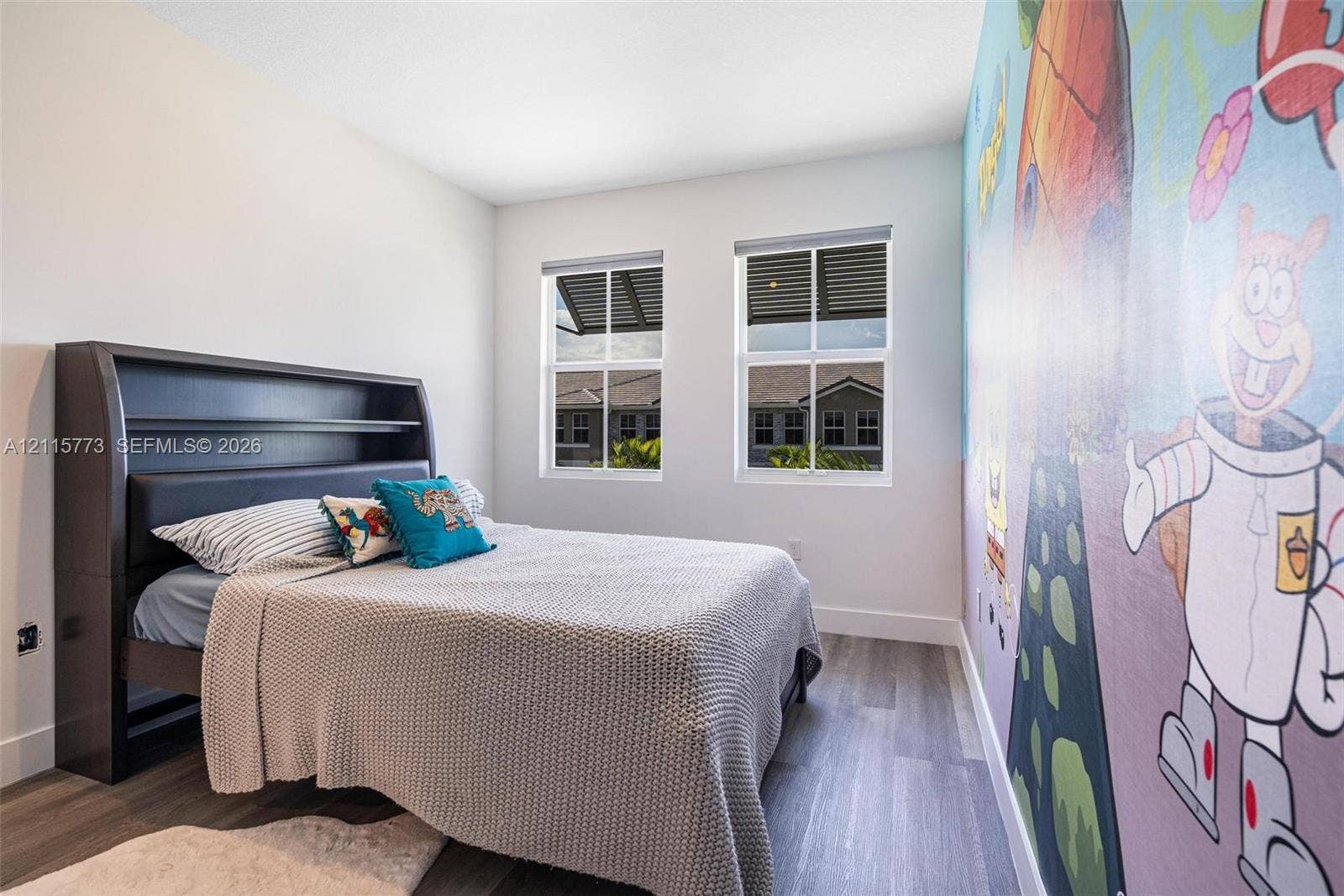 17033 SW 1st Street, #1, Pembroke Pines, Pembroke Pines, FL 33027 Room featuring two windows, wood-finish flooring, and painted wall mural