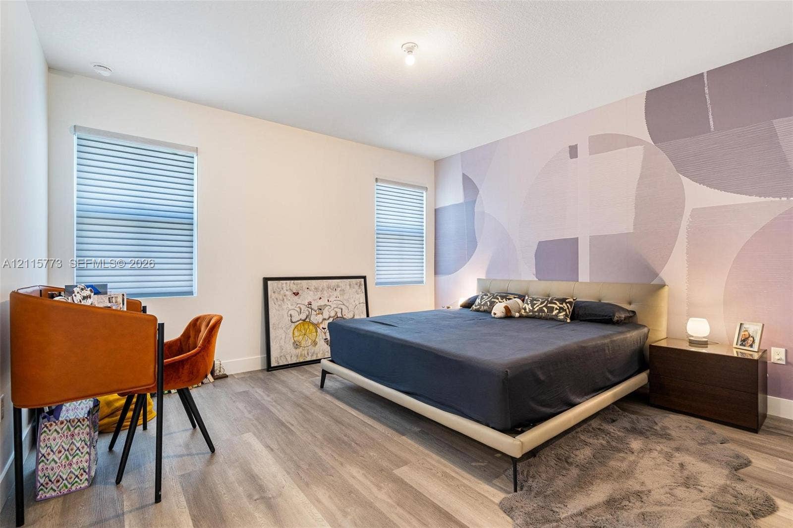 17033 SW 1st Street, #1, Pembroke Pines, Pembroke Pines, FL 33027 Wood-finish flooring, dual windows with fitted blinds, and a decorative accent wall