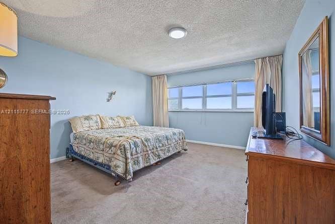 215 SE 3rd Avenue, #501B, Hallandale Beach, FL 33009 Room featuring expansive horizontal windows, neutral wall coloring, and wall-to-wall carpeting
