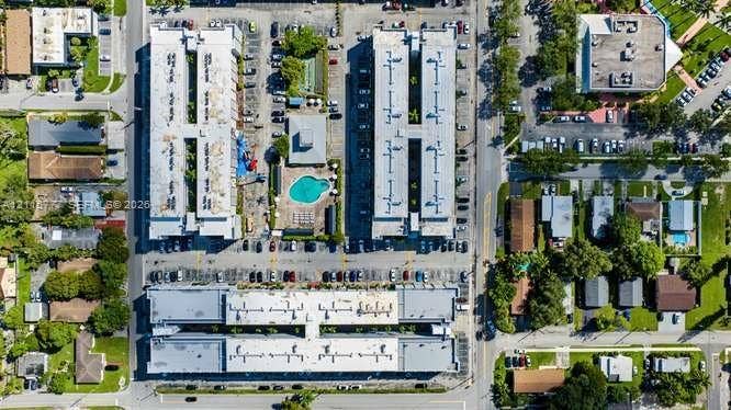 215 SE 3rd Avenue, #501B, Hallandale Beach, FL 33009 Aerial perspective of a multi-building residential complex featuring surface parking lots and a centrally located swimming pool