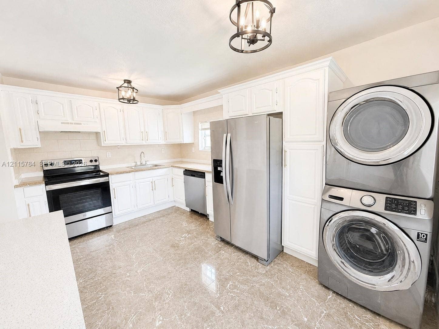 3655 SW 24th Terrace, #1, Miami, Miami, FL 33145 Kitchen featuring white cabinetry, stone-finish countertops, stainless steel appliances, stone-look tile flooring, and decorative lantern-style pendant lighting
