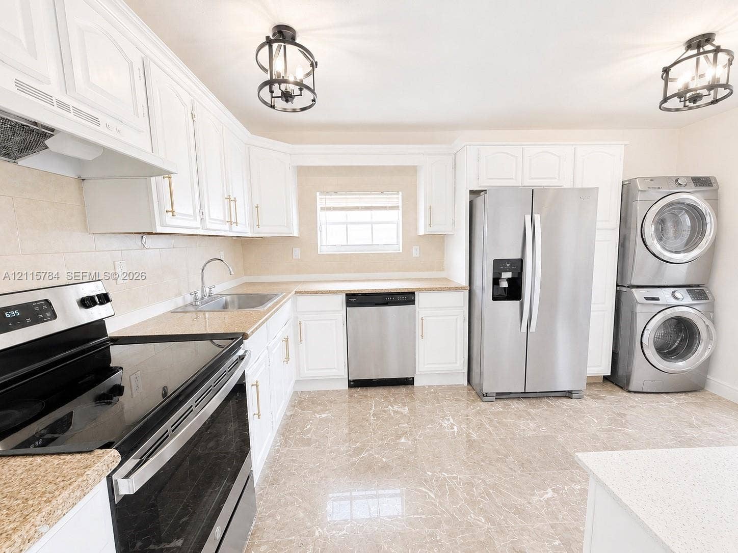 3655 SW 24th Terrace, #1, Miami, Miami, FL 33145 Kitchen featuring white cabinetry with brushed-gold hardware, stainless steel appliances, stone-finish countertops, tile flooring, and dual lantern-style pendant lighting