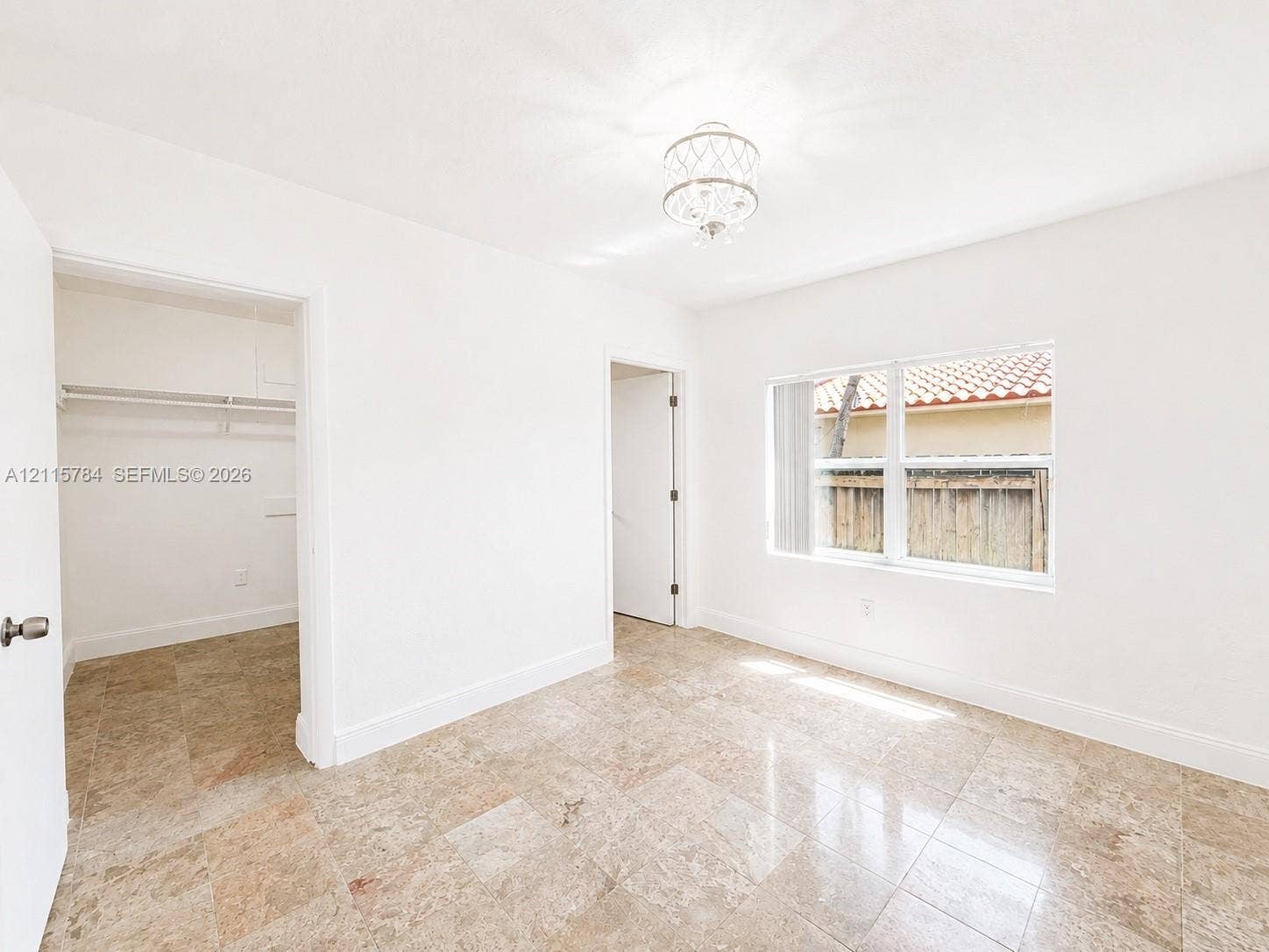 3655 SW 24th Terrace, #1, Miami, Miami, FL 33145 Polished stone flooring, recessed overhead lighting, and white walls featuring a multi-pane window with a neutral finish