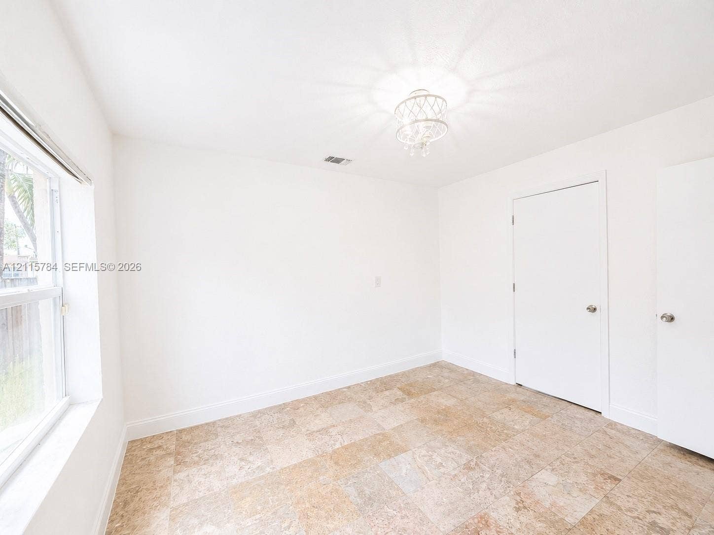 3655 SW 24th Terrace, #1, Miami, Miami, FL 33145 Neutral-toned stone-finish tile flooring, decorative semi-flush mount lighting, and multi-pane window with white frame