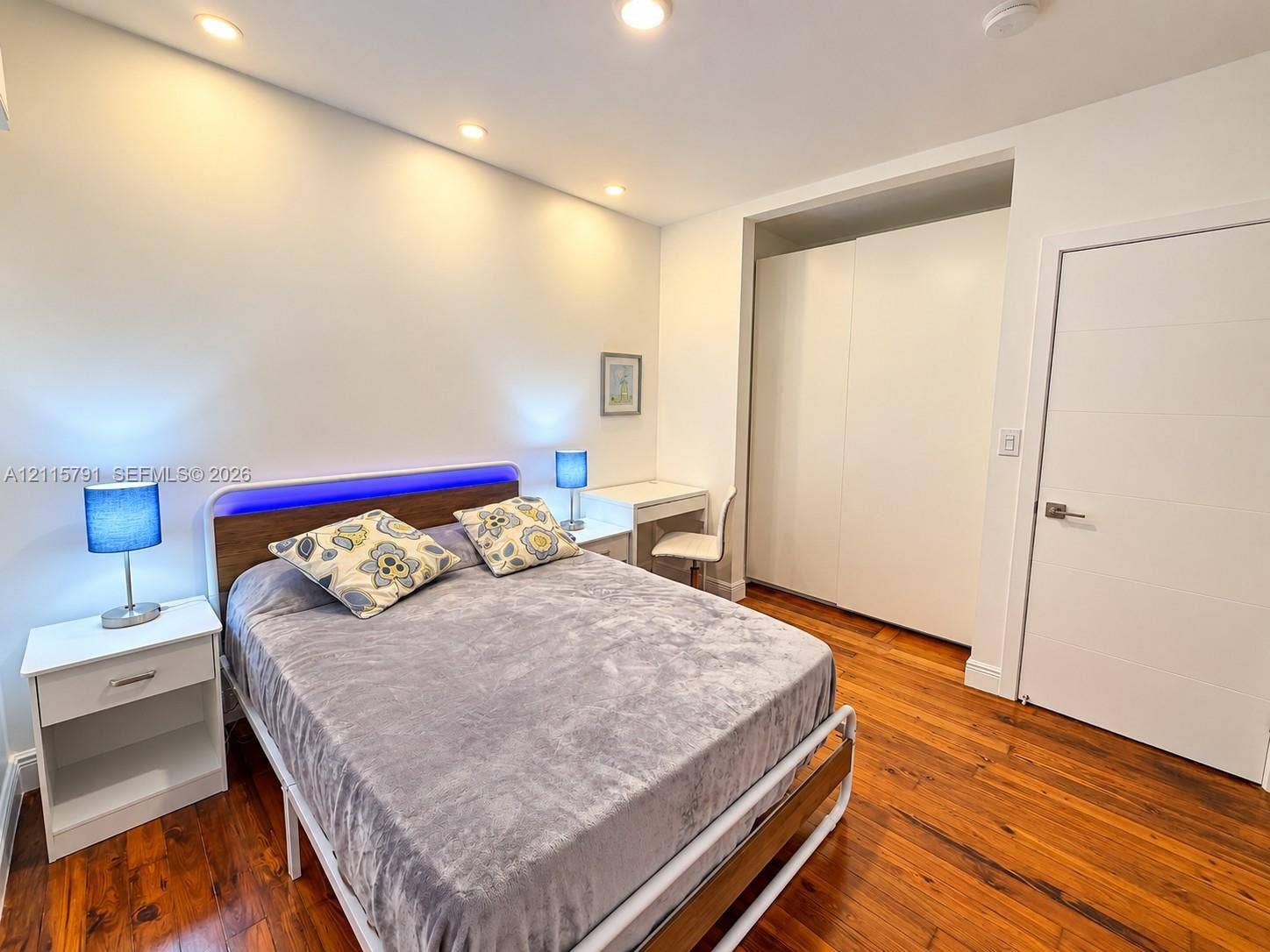 1455 Michigan Avenue, #19B, Miami Beach, Miami Beach, FL 33139 Wood-finish flooring, recessed ceiling lighting, and built-in floor-to-ceiling cabinetry with white panel doors