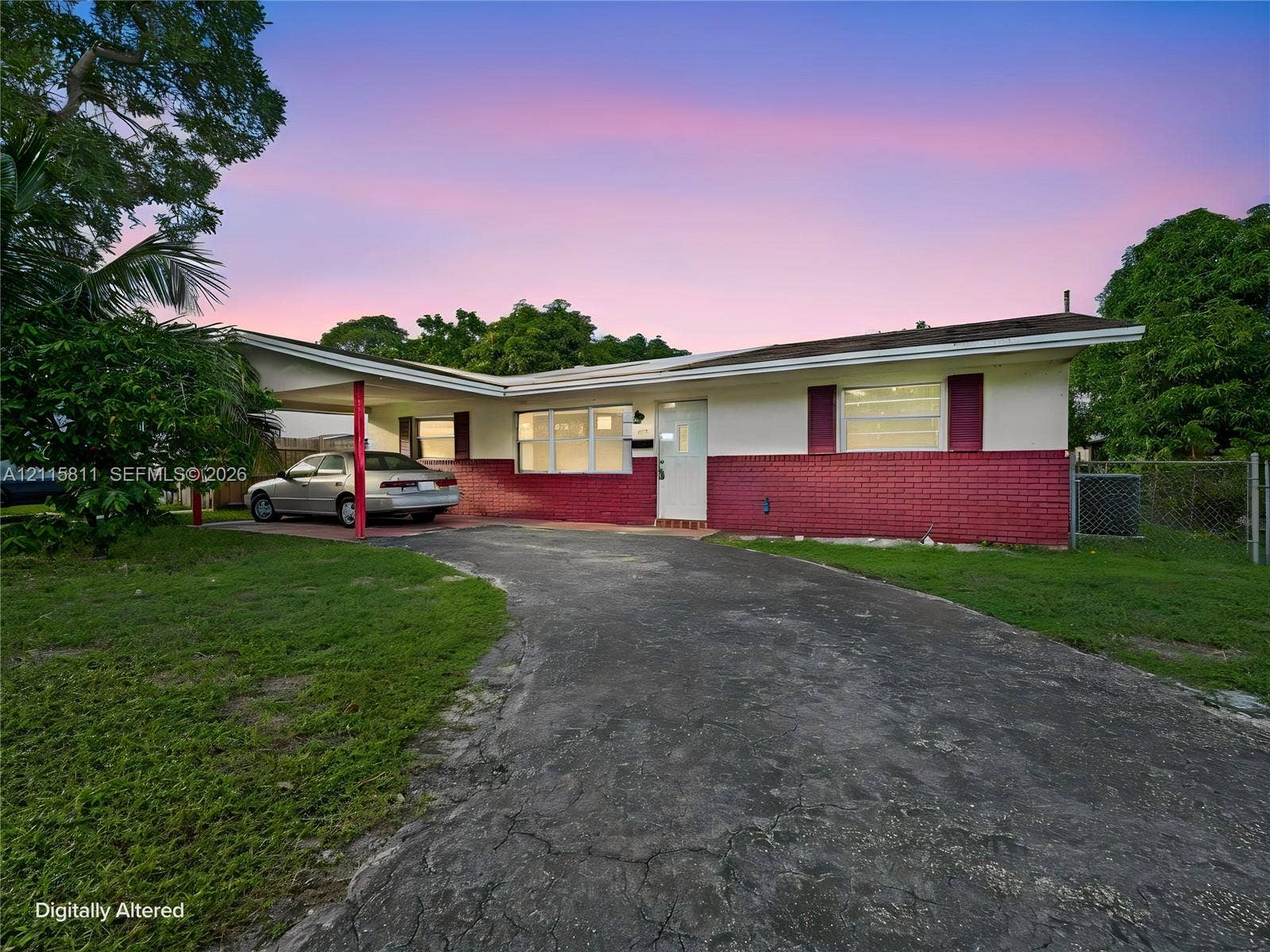 441 NE 30th Court, Pompano Beach, FL 33064 Single-story exterior featuring a brick facade, covered carport, and horizontal sliding windows