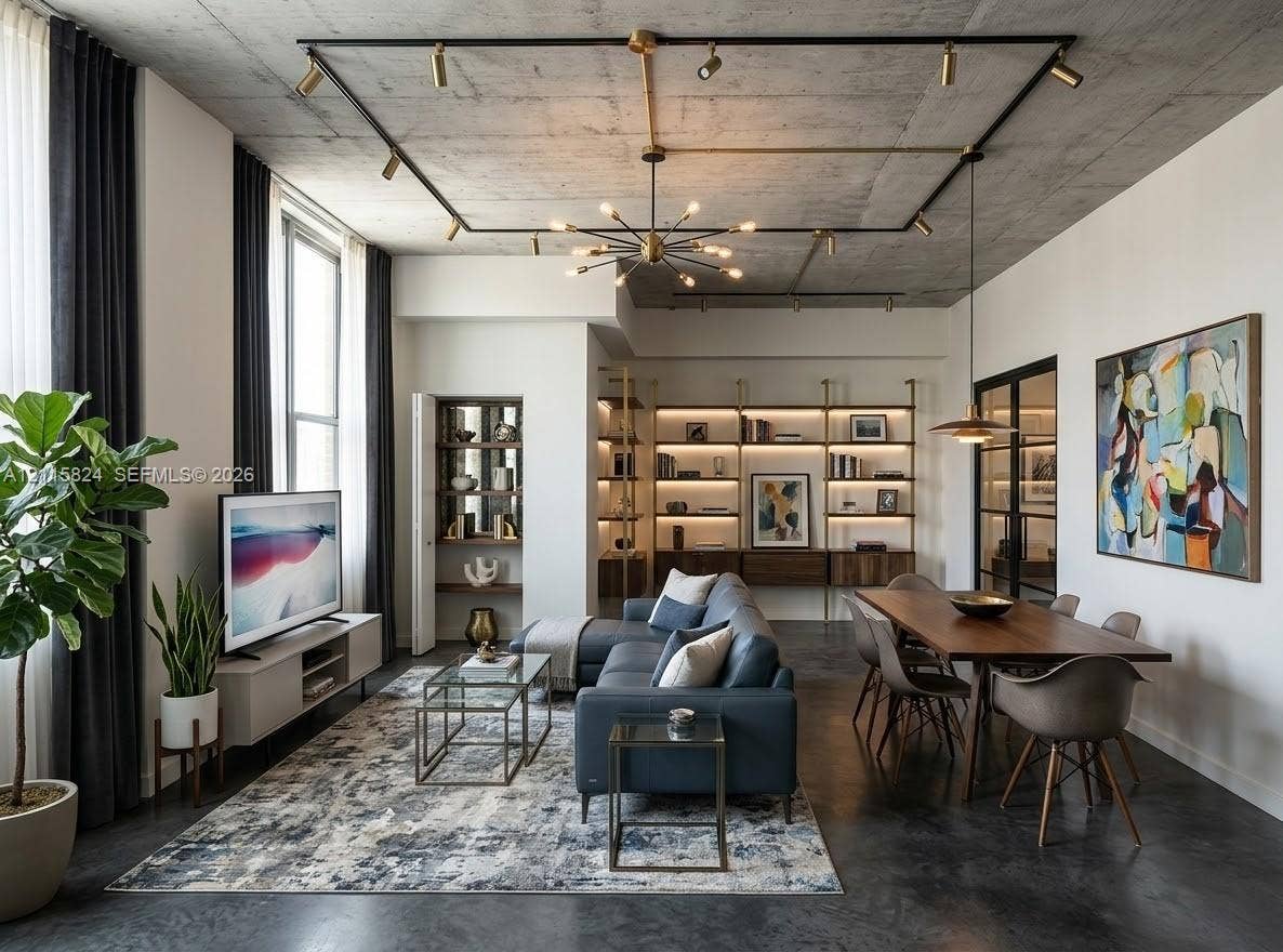 133 2 Avenue, #2908, Miami, Miami, FL 33132 Exposed raw concrete ceiling with integrated track lighting, polished concrete flooring, custom floor-to-ceiling built-in shelving, and black-framed glass paneled doors