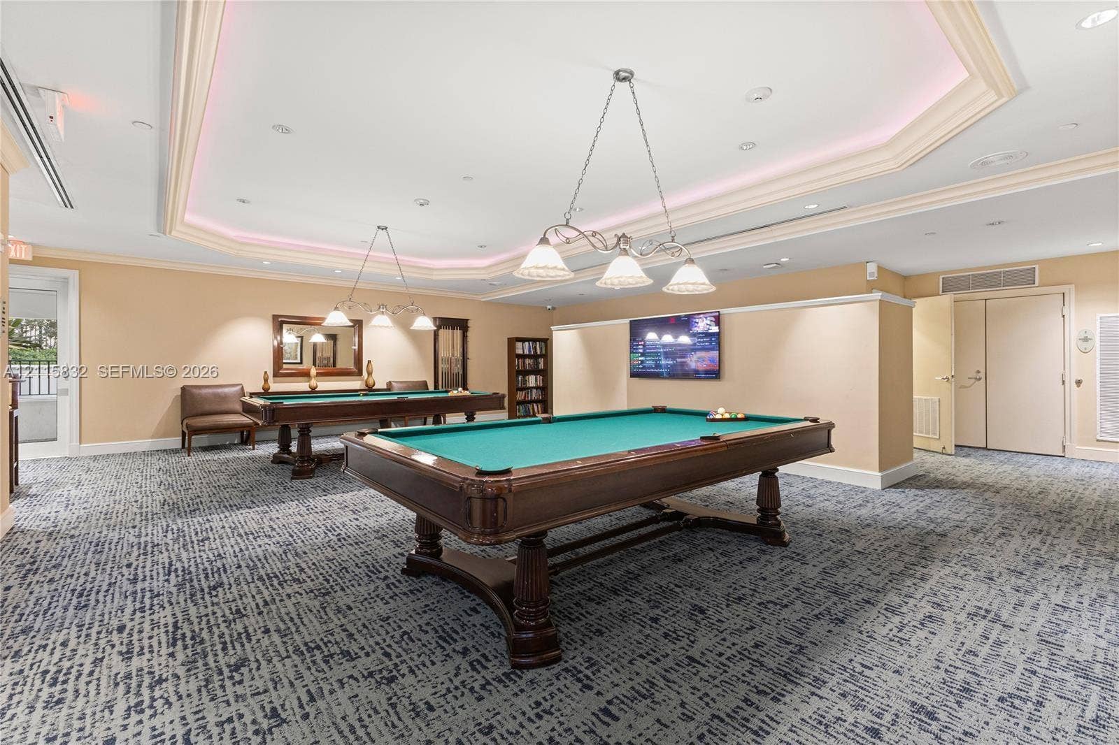 19900 E Country Club Drive, #607, Aventura, Aventura, FL 33180 Tray ceiling with recessed ambient lighting, decorative multi-light chandeliers, and neutral wall tones