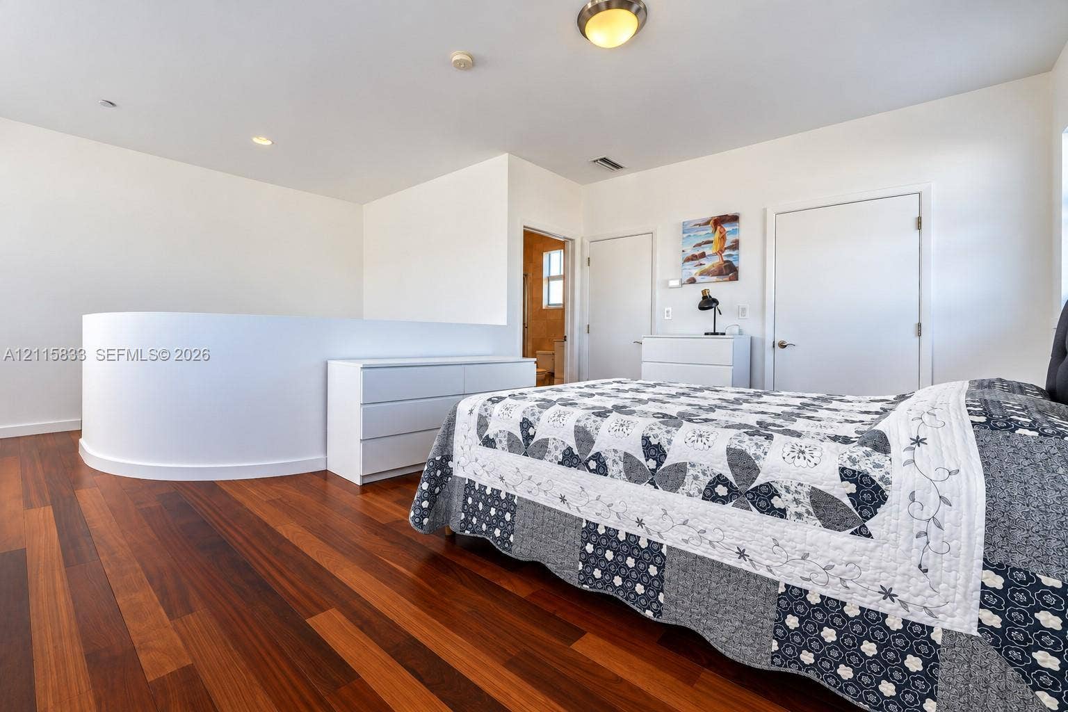 929 Meridian Avenue, #5, Miami Beach, FL 33139 Wood-finish flooring, curved partition wall, and recessed ceiling lighting
