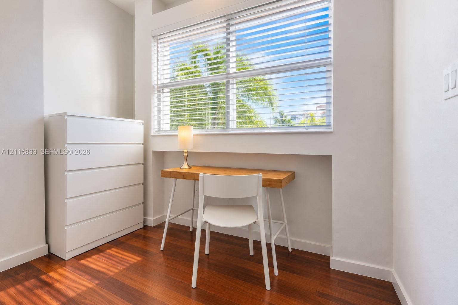 929 Meridian Avenue, #5, Miami Beach, FL 33139 Interior space featuring wood-finish flooring, a recessed window alcove, and horizontal window blinds