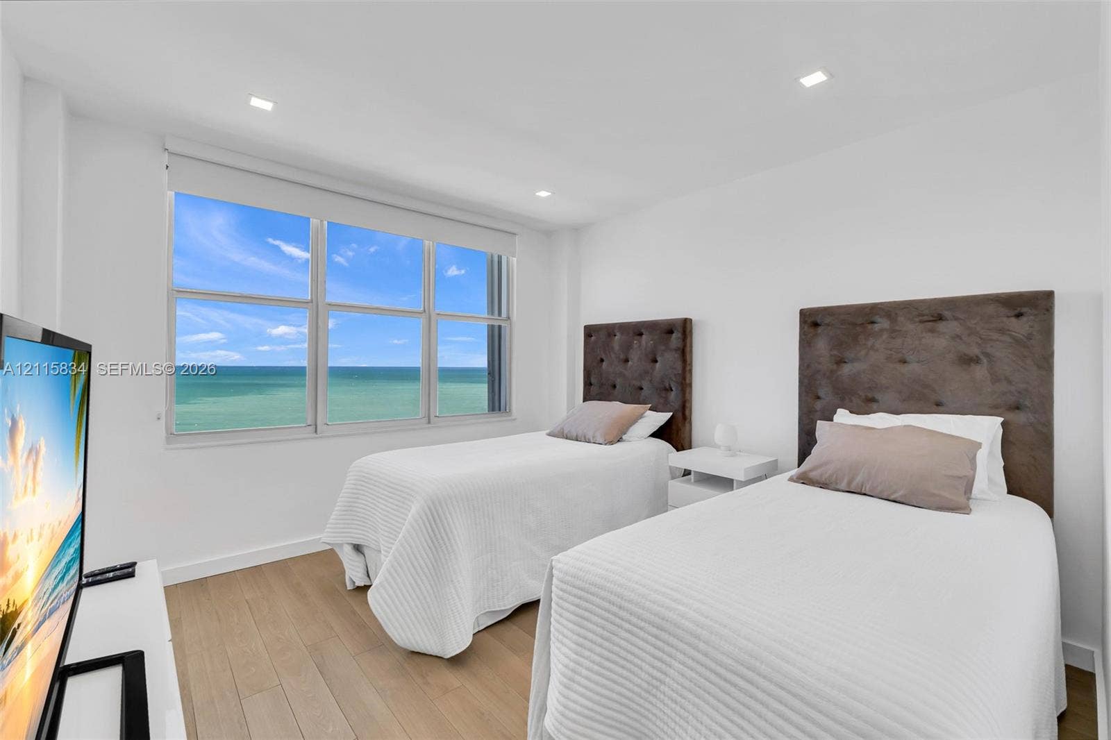 5161 Collins Avenue, #1717, Miami Beach, Miami Beach, FL 33140 Large windows with ocean scenery, wood-finish flooring, and recessed ceiling lighting