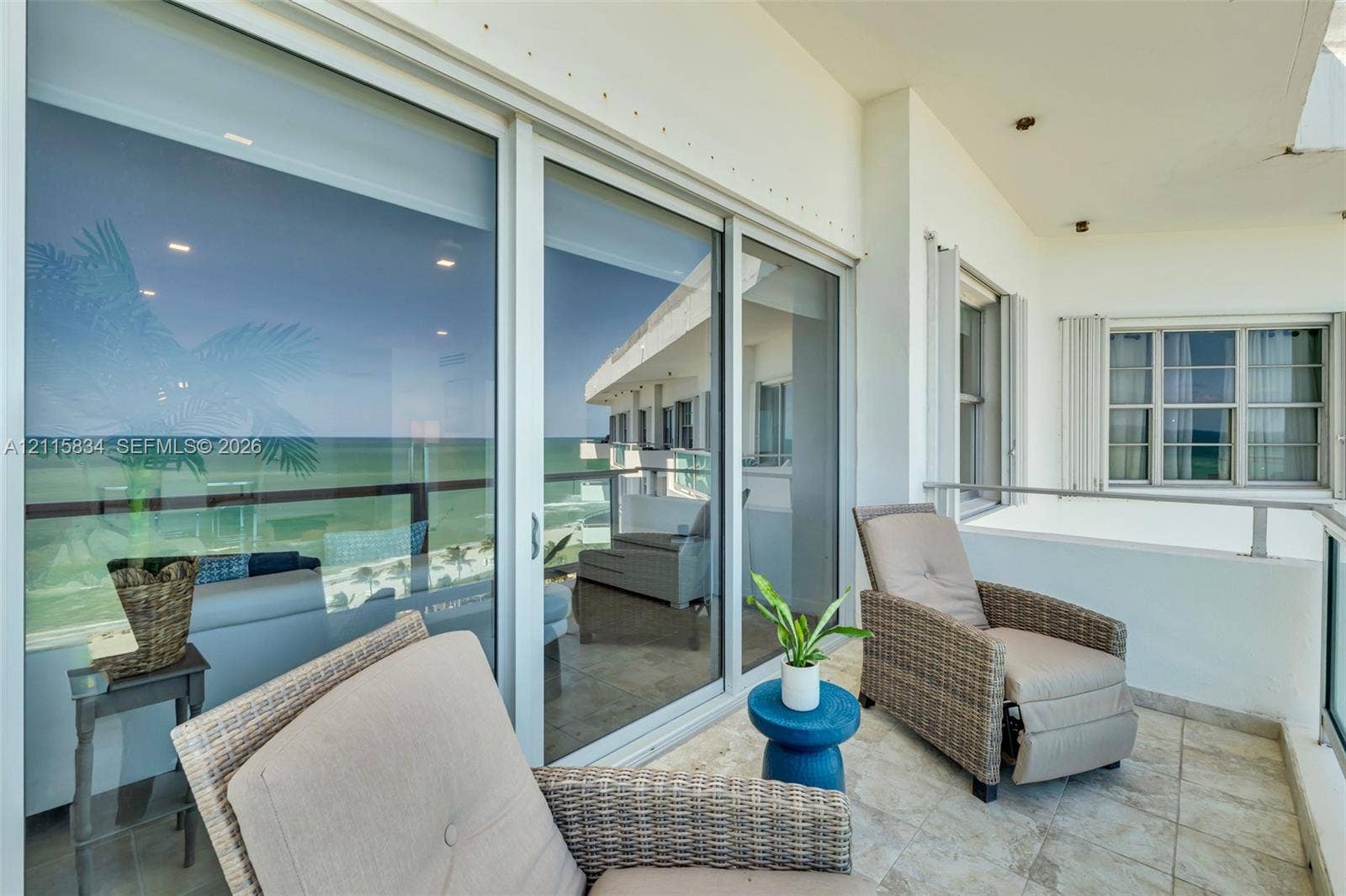 5161 Collins Avenue, #1717, Miami Beach, Miami Beach, FL 33140 Covered balcony featuring tile flooring, metal railing, recessed ceiling lighting, and large sliding glass doors