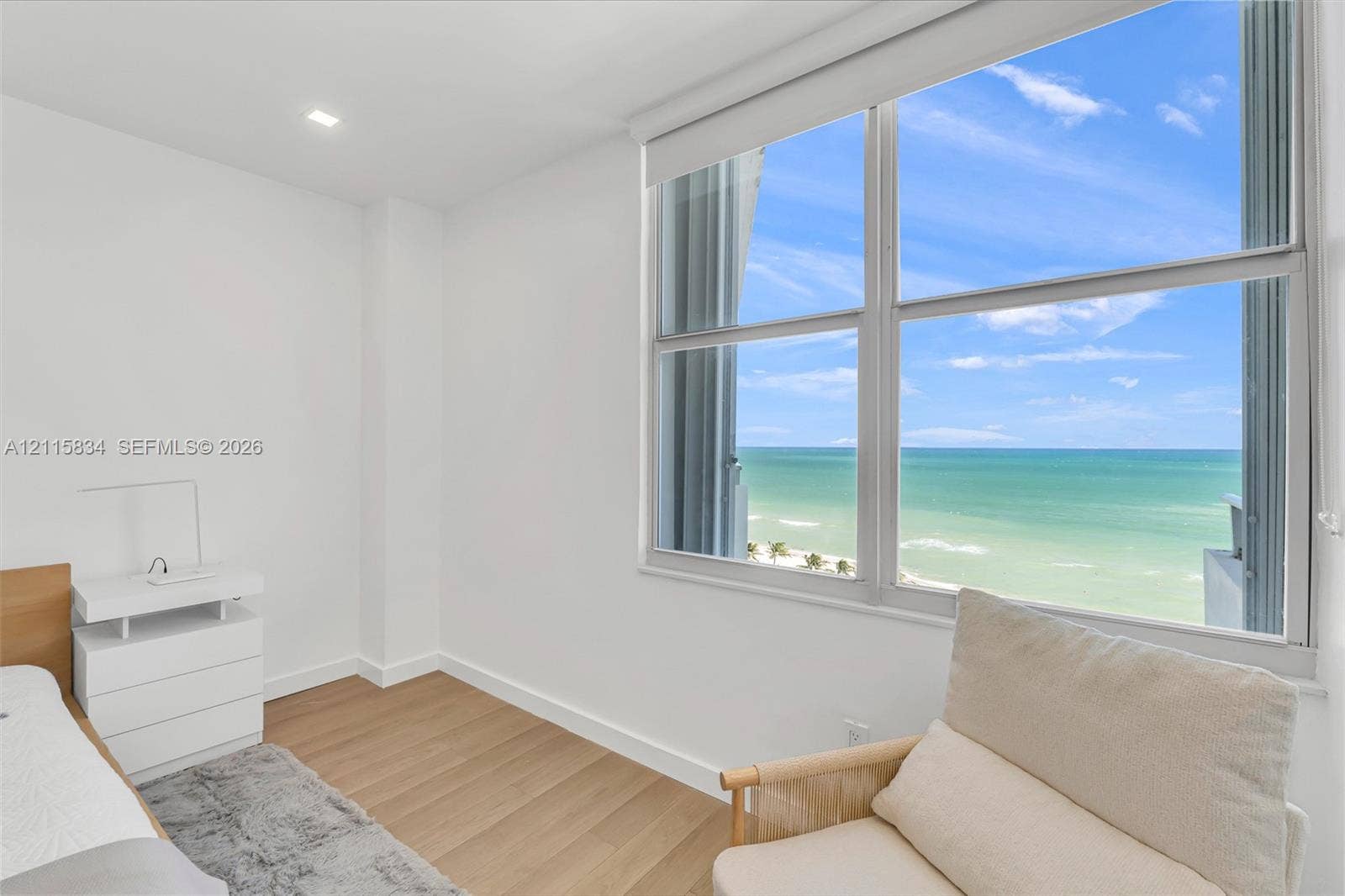 5161 Collins Avenue, #1717, Miami Beach, Miami Beach, FL 33140 Large windows with ocean scenery, wood-finish flooring, and recessed ceiling lighting