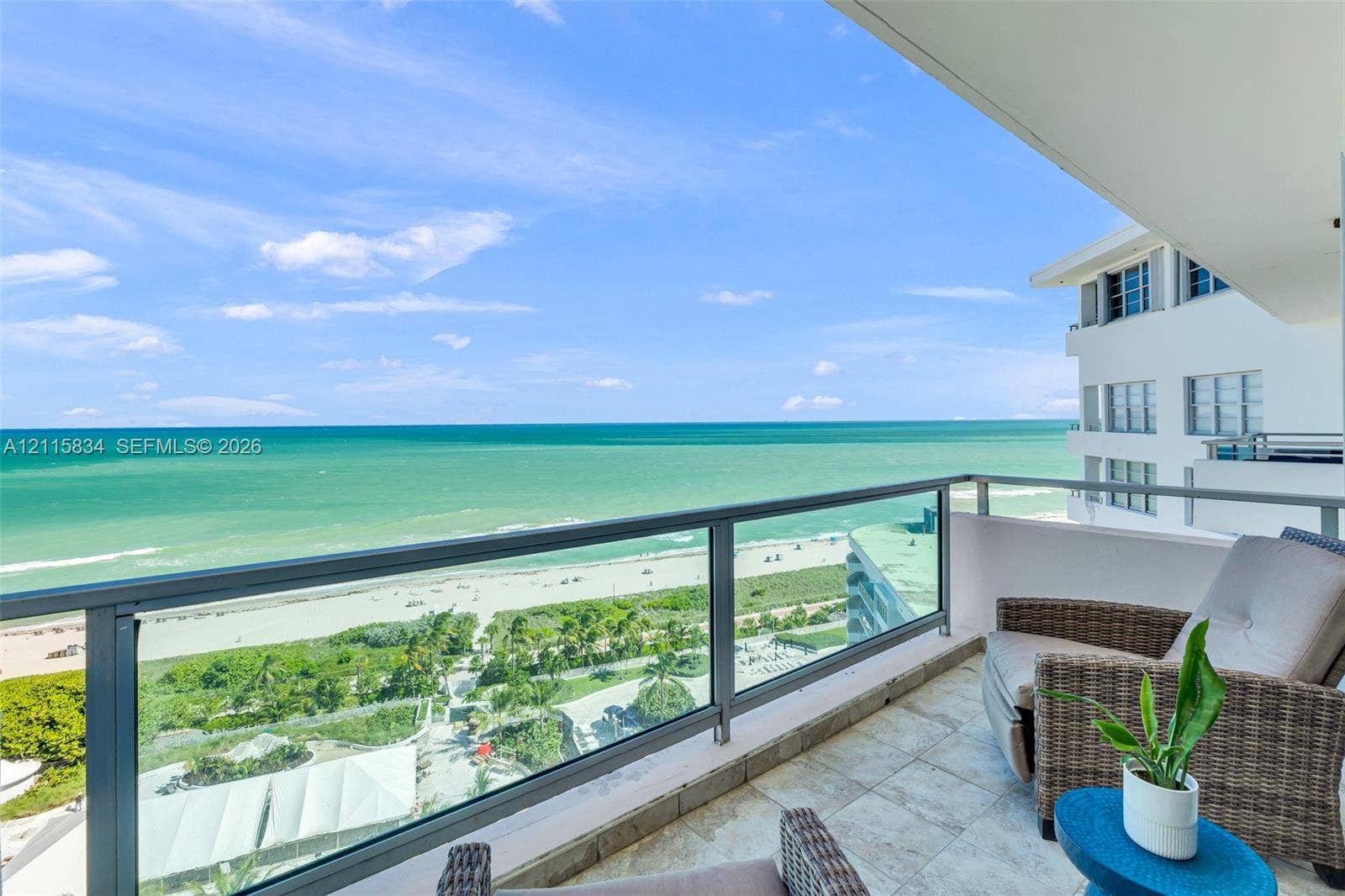 5161 Collins Avenue, #1717, Miami Beach, Miami Beach, FL 33140 Covered balcony featuring stone tile flooring and a glass panel railing with a direct ocean and beach vista