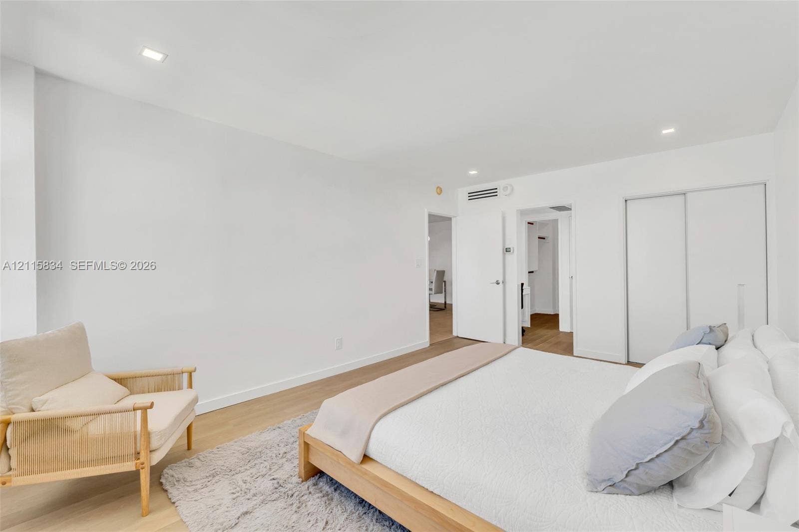5161 Collins Avenue, #1717, Miami Beach, Miami Beach, FL 33140 Room featuring wood-finish flooring, recessed lighting, and a sliding-door closet