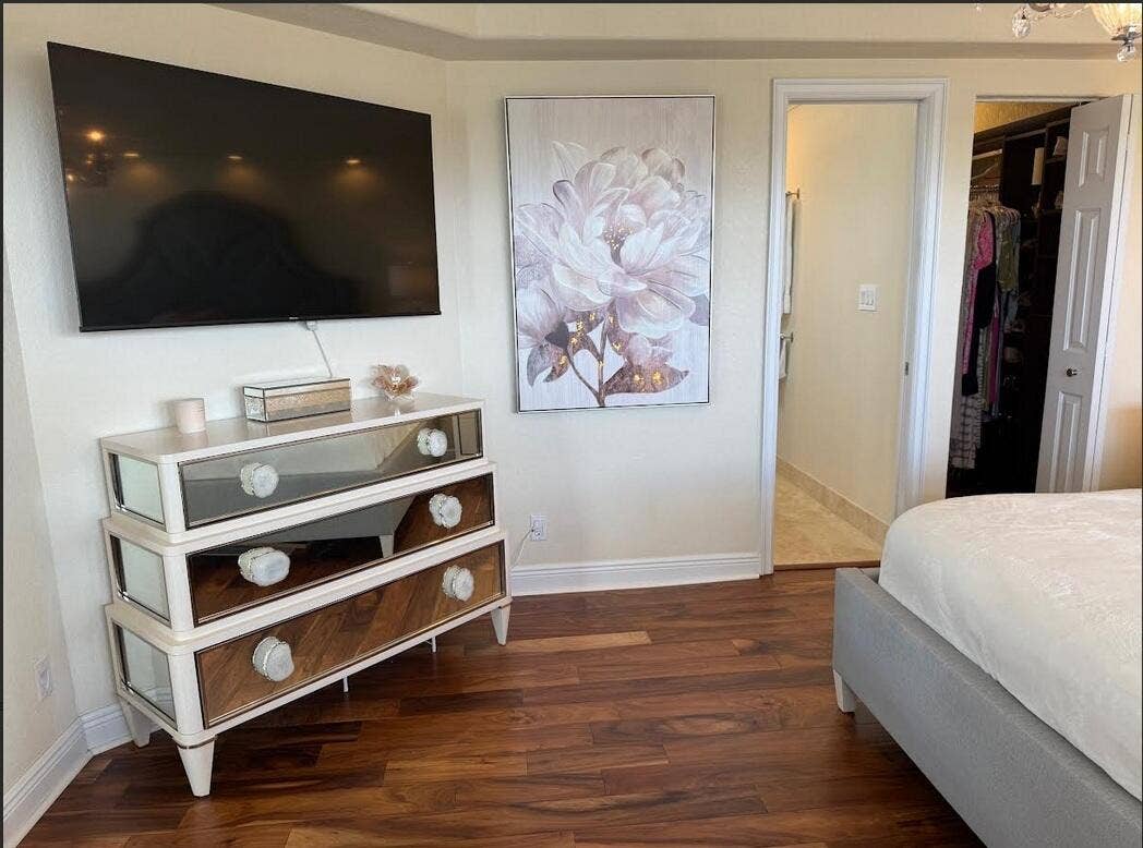 2000 S Ocean Drive, #804, Fort Lauderdale, FL 33316 Master bedroom showing TV, bathroom, and walk in closet entrances.