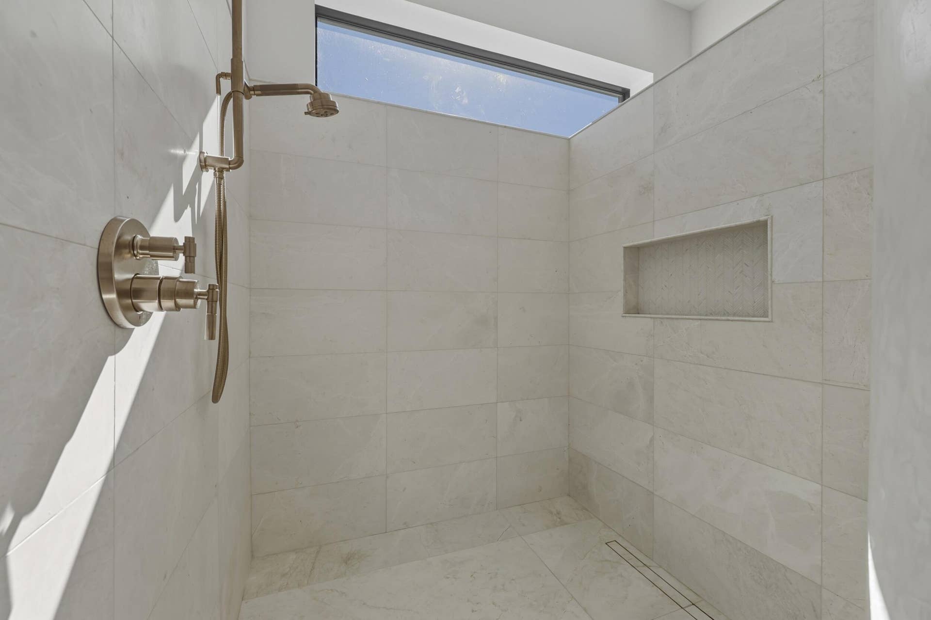 Stunning walk in shower with window detail & rain shower