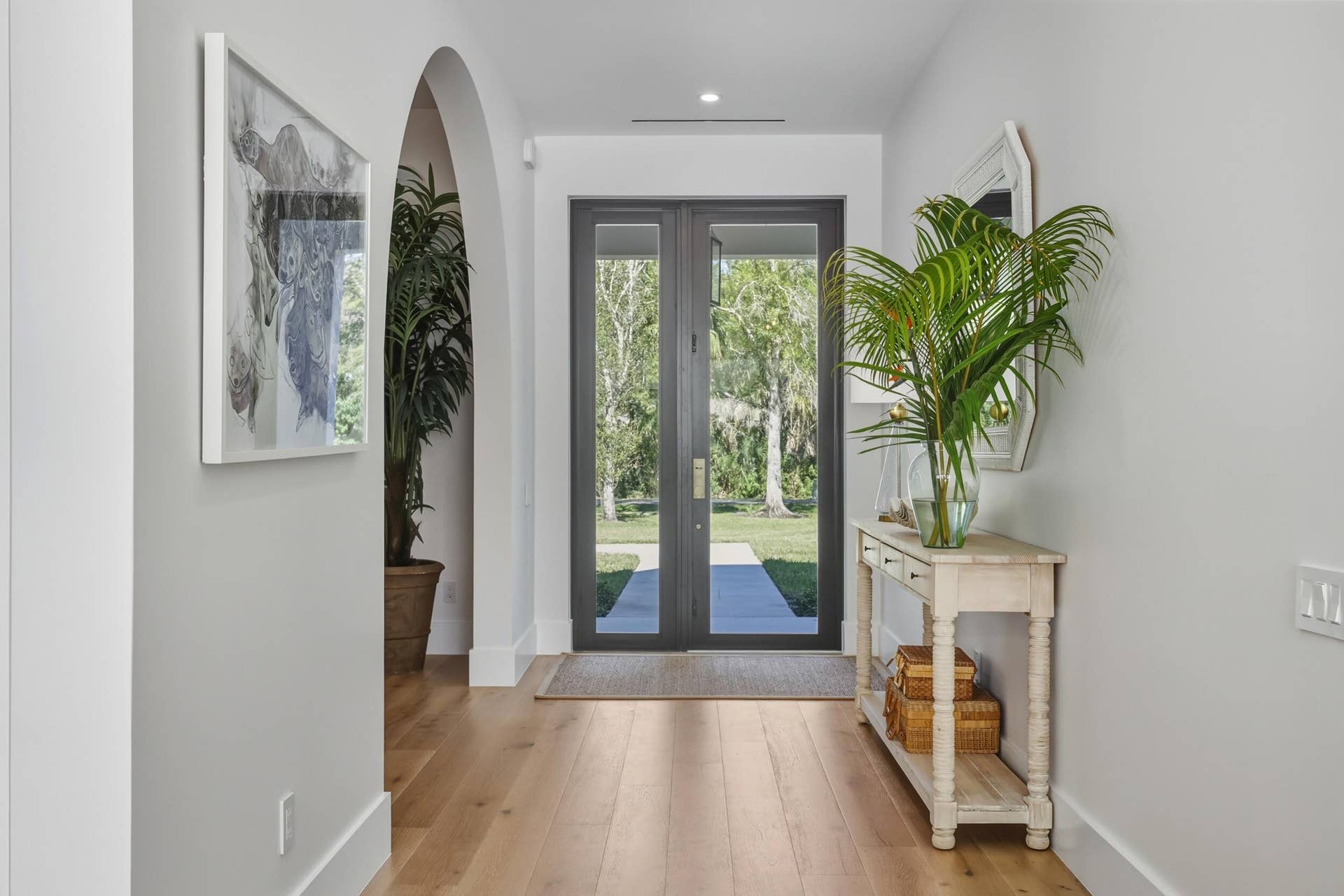 Foyer entrance with massive doors and covered entry with pendant