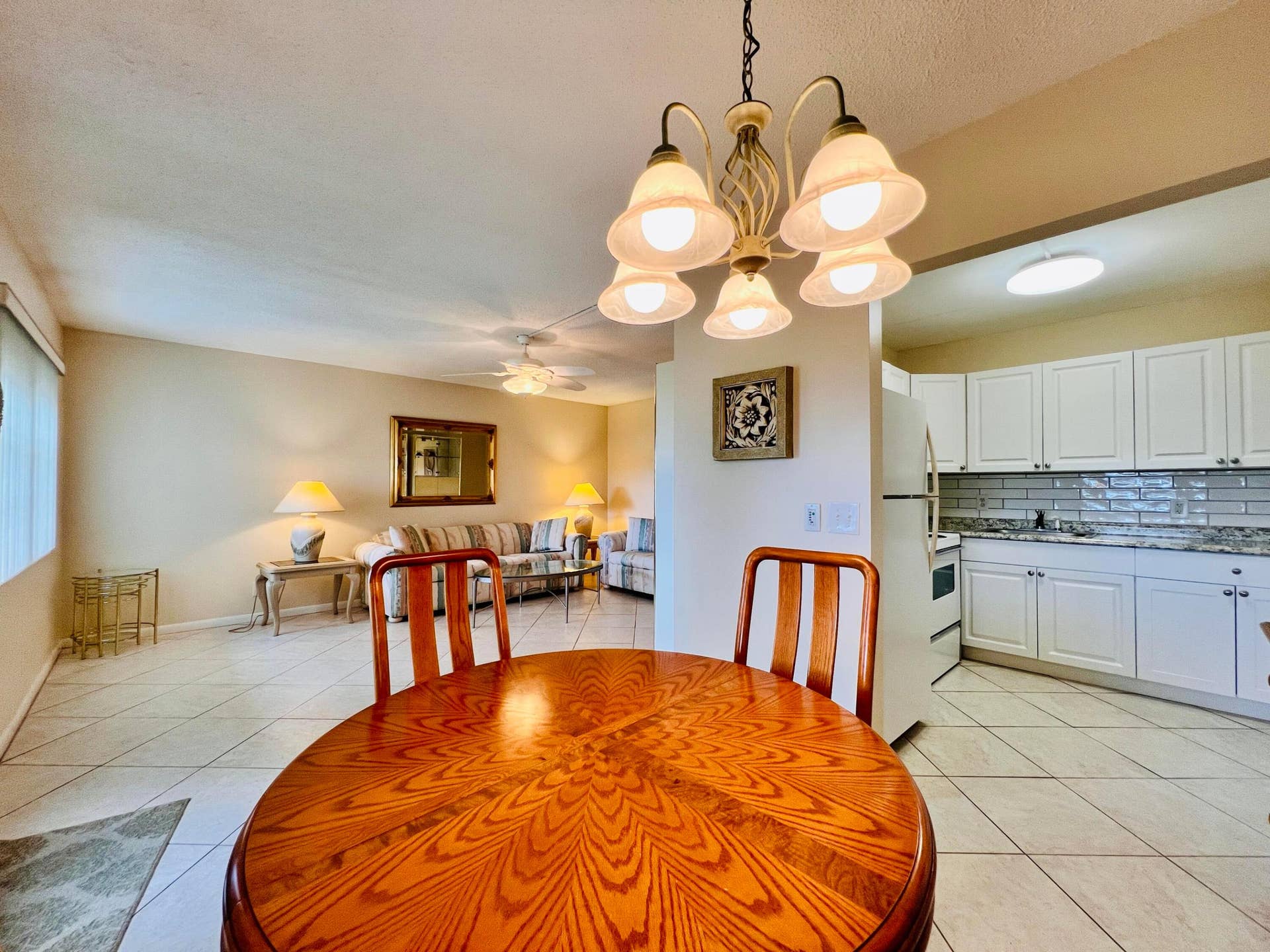 27 Sheffield B, West Palm Beach, FL 33417 Light & Bright Floor Plan. Neutral Tile Flooring Flows Through Out the Living, Dining, Kitchen, and Bedroom 2