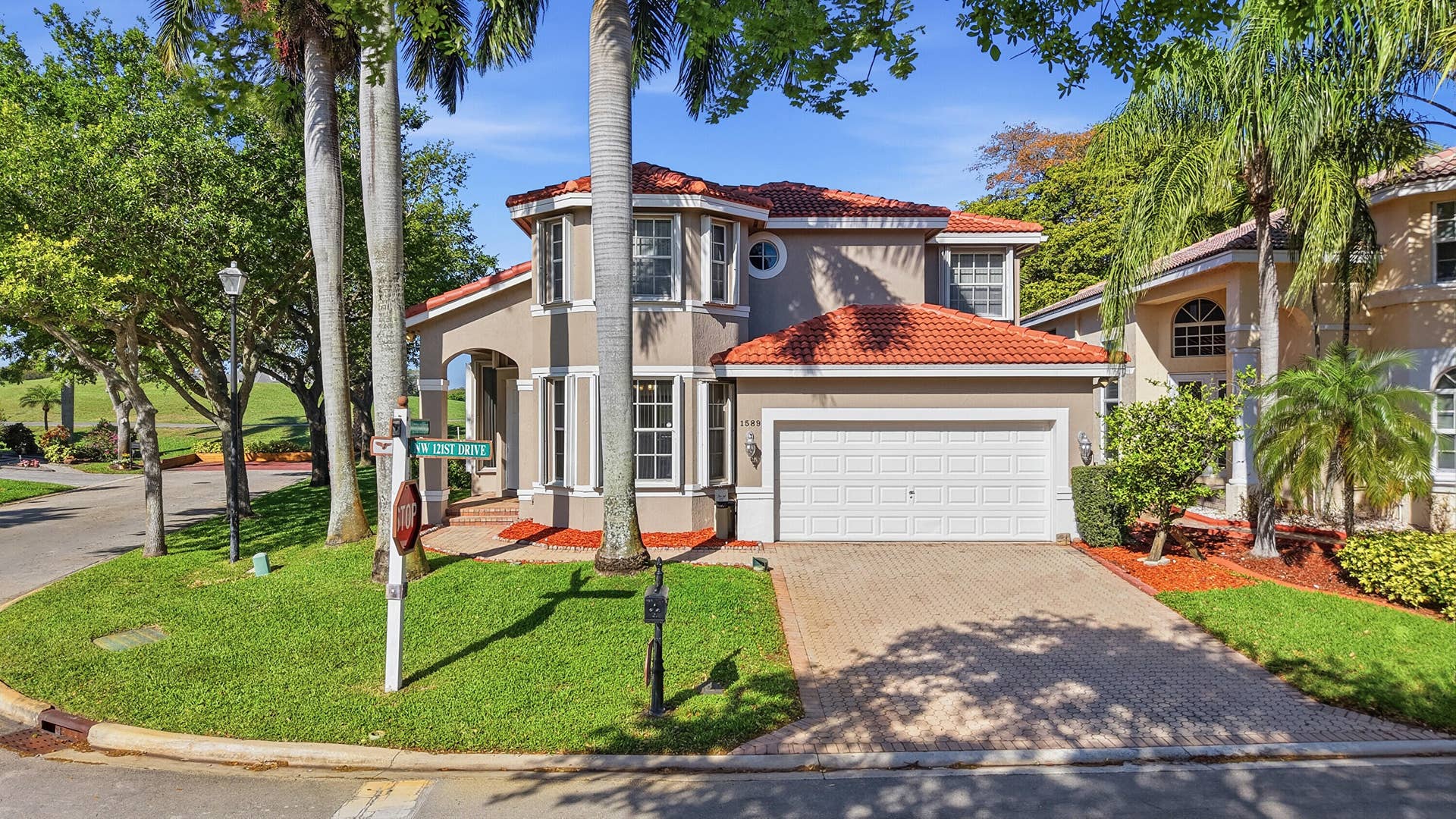 1589 NW 121st Drive, Coral Springs, FL 33071 OVER-SIZED CORNER LOT ON THE 18TH HOLE WITH EXTRA DEEDED PARKING ON THE SIDE YARD.