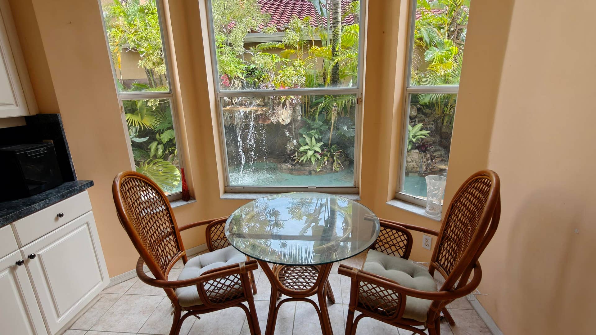 Breakfast area attached to kitchen- View of pool