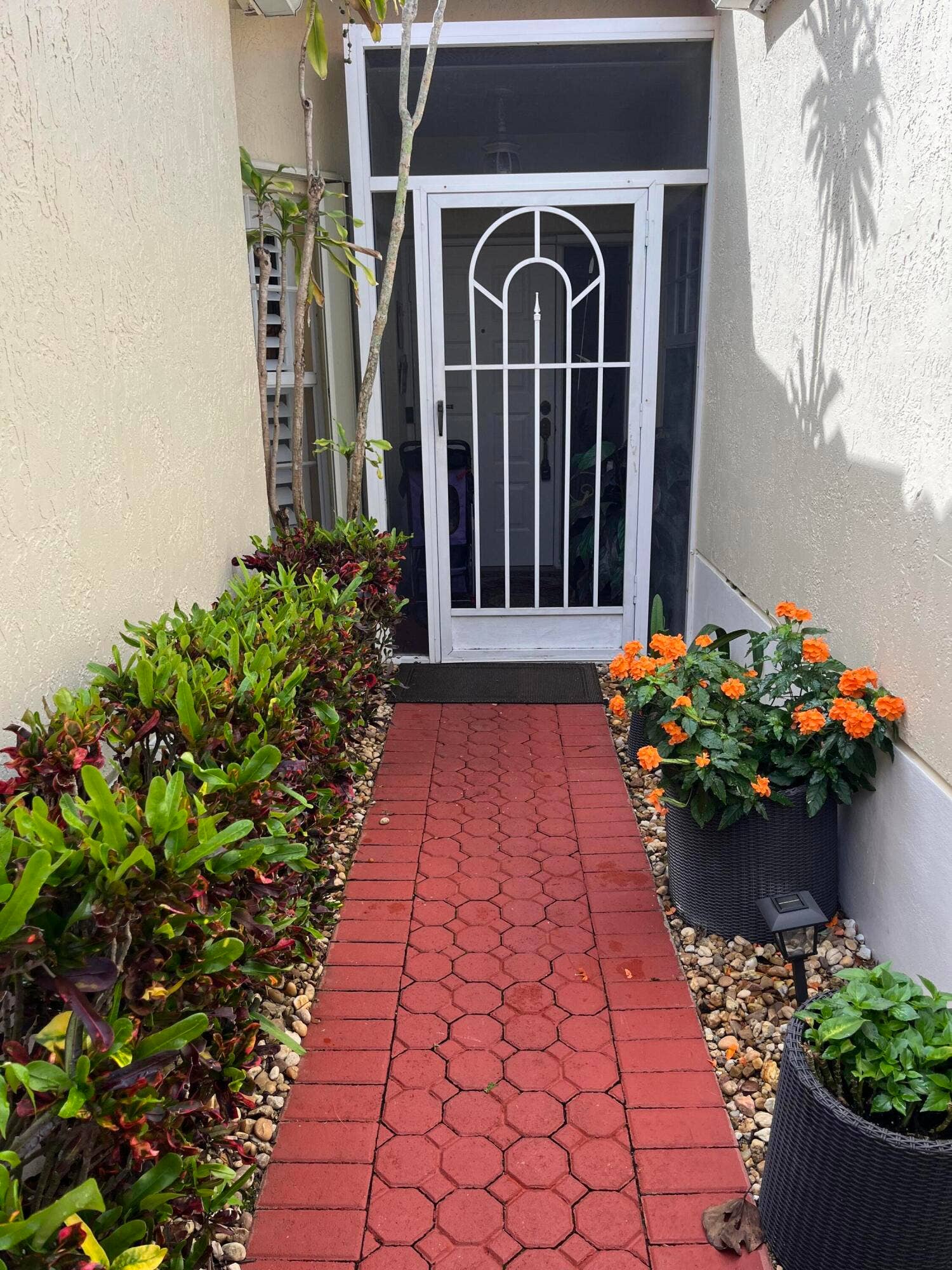 6108 Petunia Road, Delray Beach, FL 33484 front paver walkway to screened in vestibule