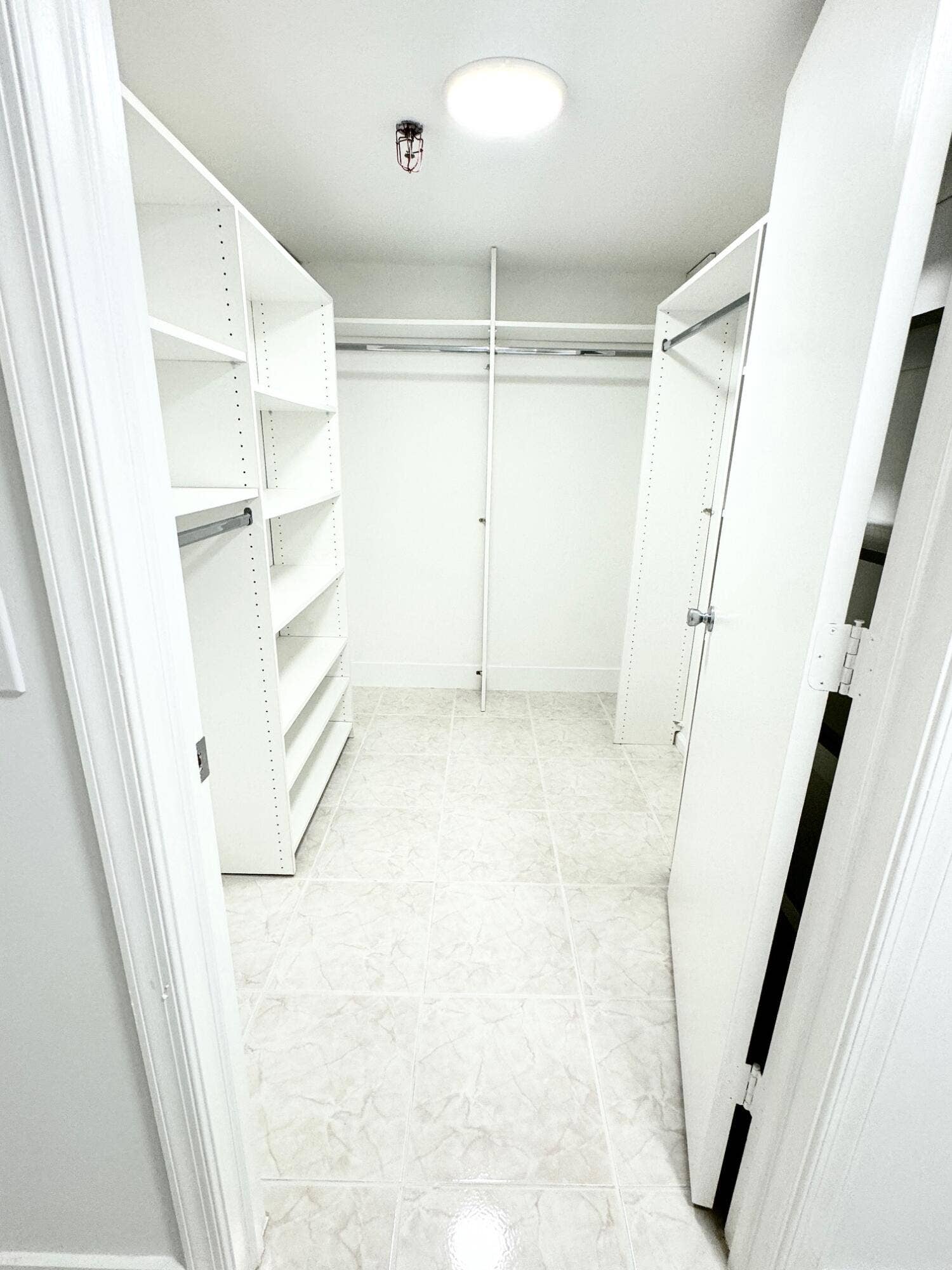 PRIMARY BEDROOM LARGE SPACIOUS WALK IN CLOSET