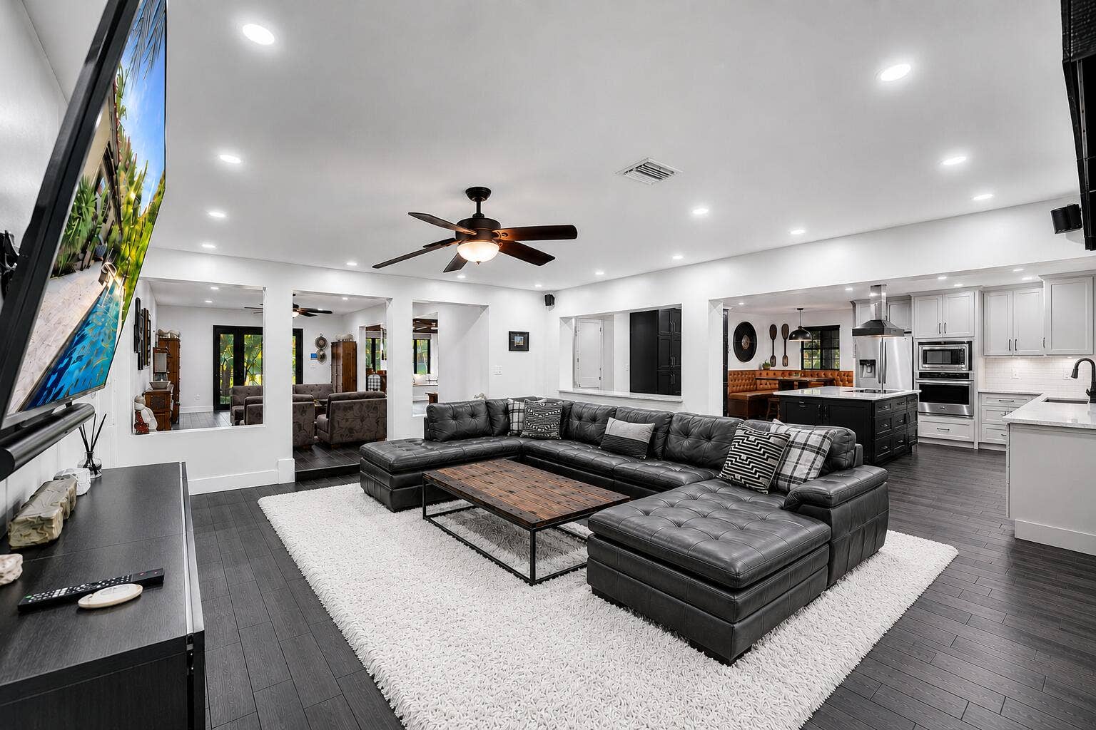Virtually reimagined with white rug & white cabinetry in kitchen.