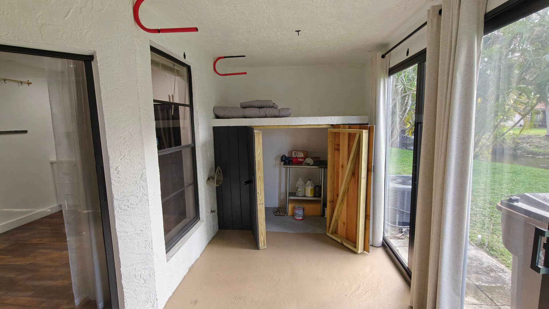 385 NW 36th Avenue, Deerfield Beach, FL 33442 Back impact sliding door enclosed patio/ tv/ secondary bedroom- Fishing pole- surfboard rack