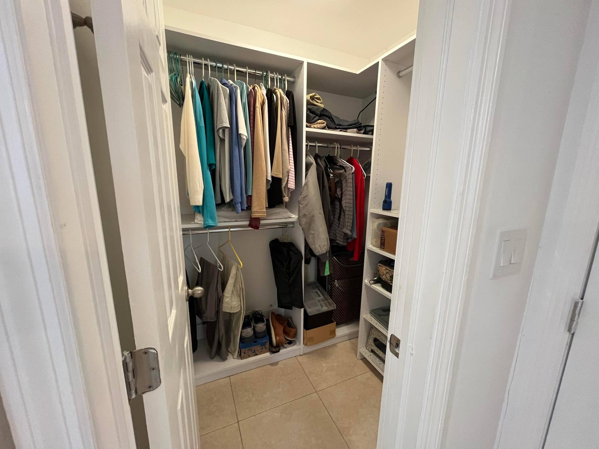 Primary walk in closet with built-ins