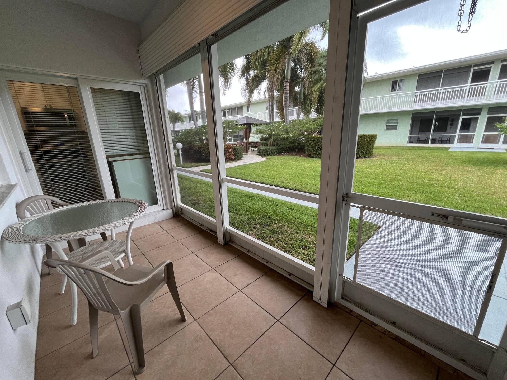 View of the courtyard from spacious screened in patio