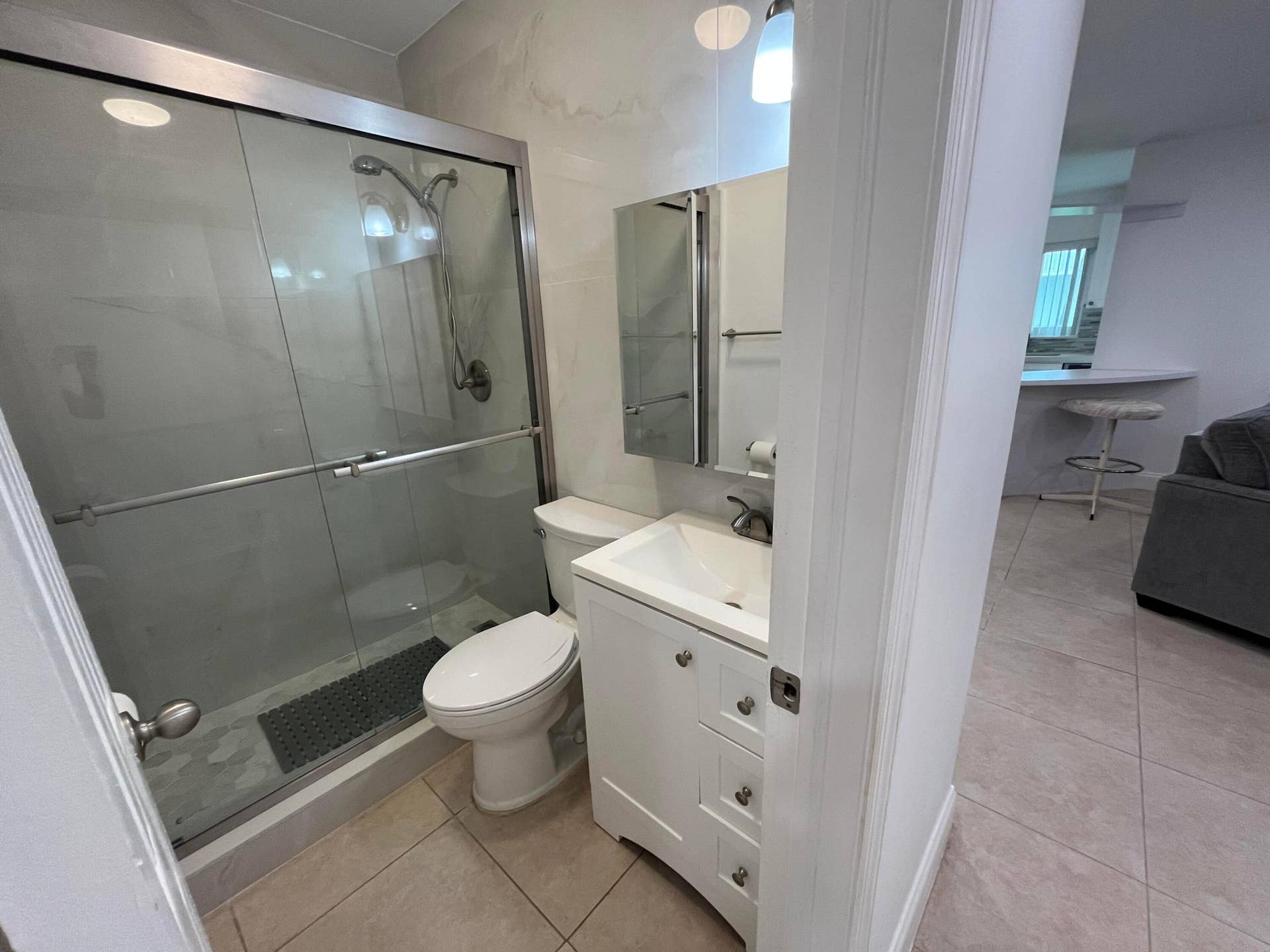 Completely updated second full bathroom with frameless shower doors