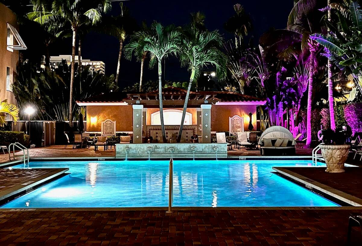 616 Clearwater Park Road, #1106, West Palm Beach, FL 33401 Evening pool lights up