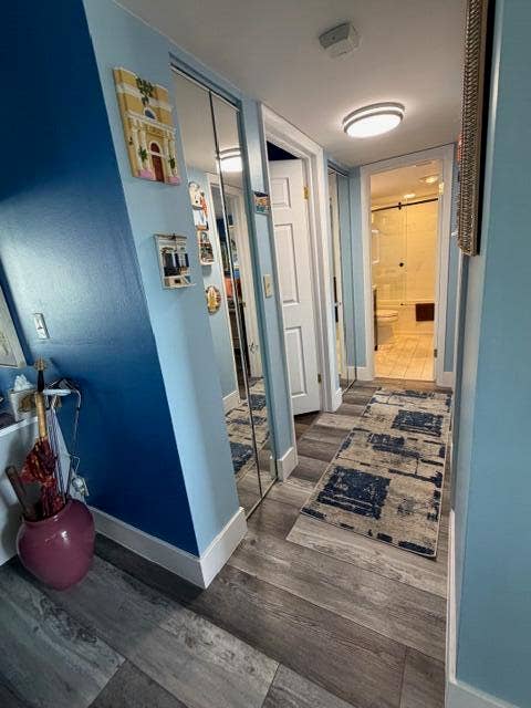 Hallway with 2 linen and extra utility closets