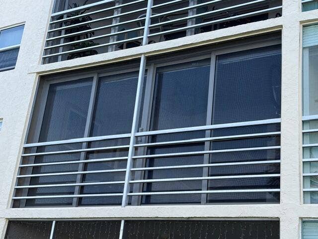 Glass enclosed balcony overlooking the lake