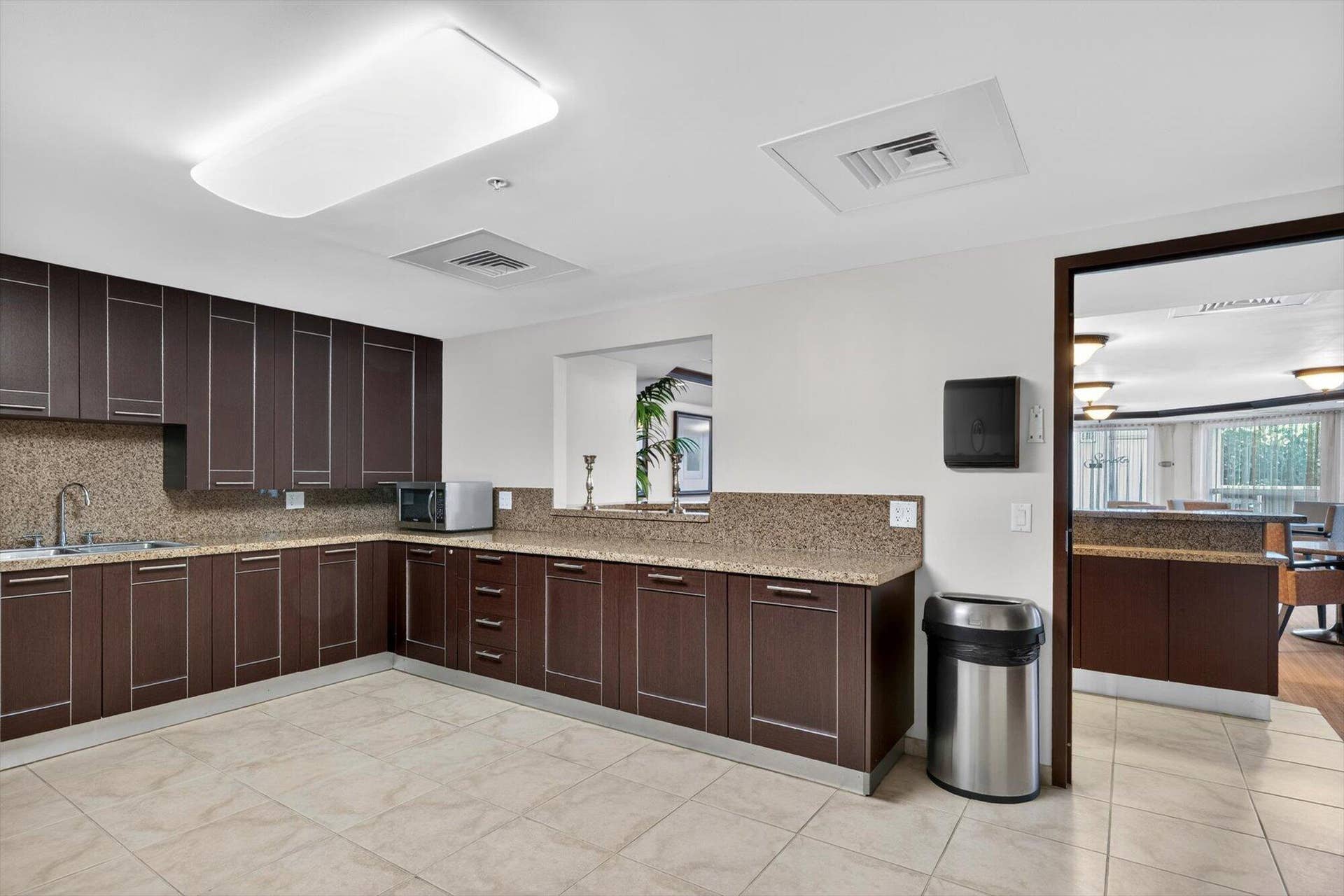 801 Briny Avenue, #1501, Pompano Beach, FL 33062 Functional kitchenette with ample cabinetry and prep space