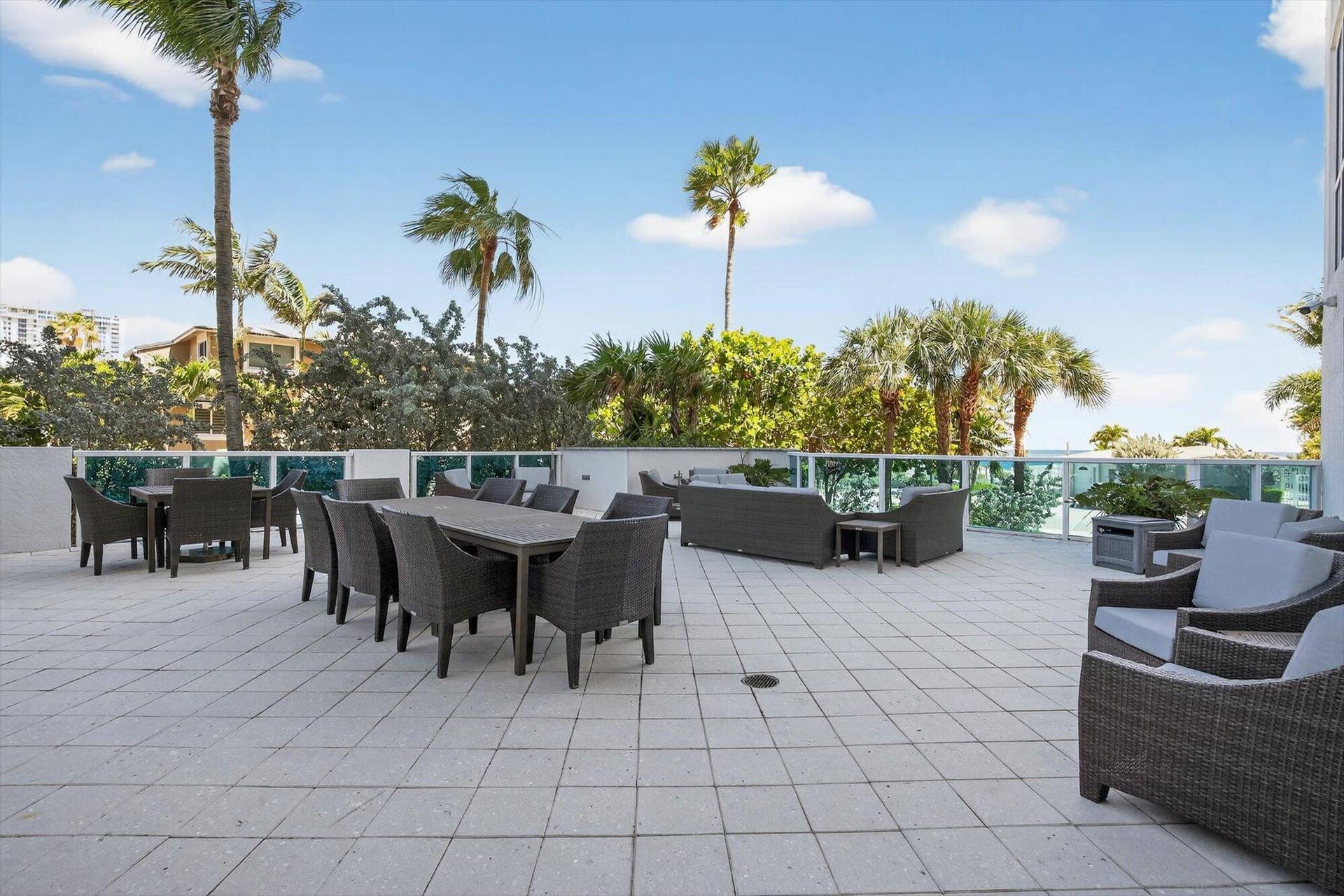 801 Briny Avenue, #1501, Pompano Beach, FL 33062 An expansive outdoor terrace with seating and dining areas, perfect for entertaining just off the community room