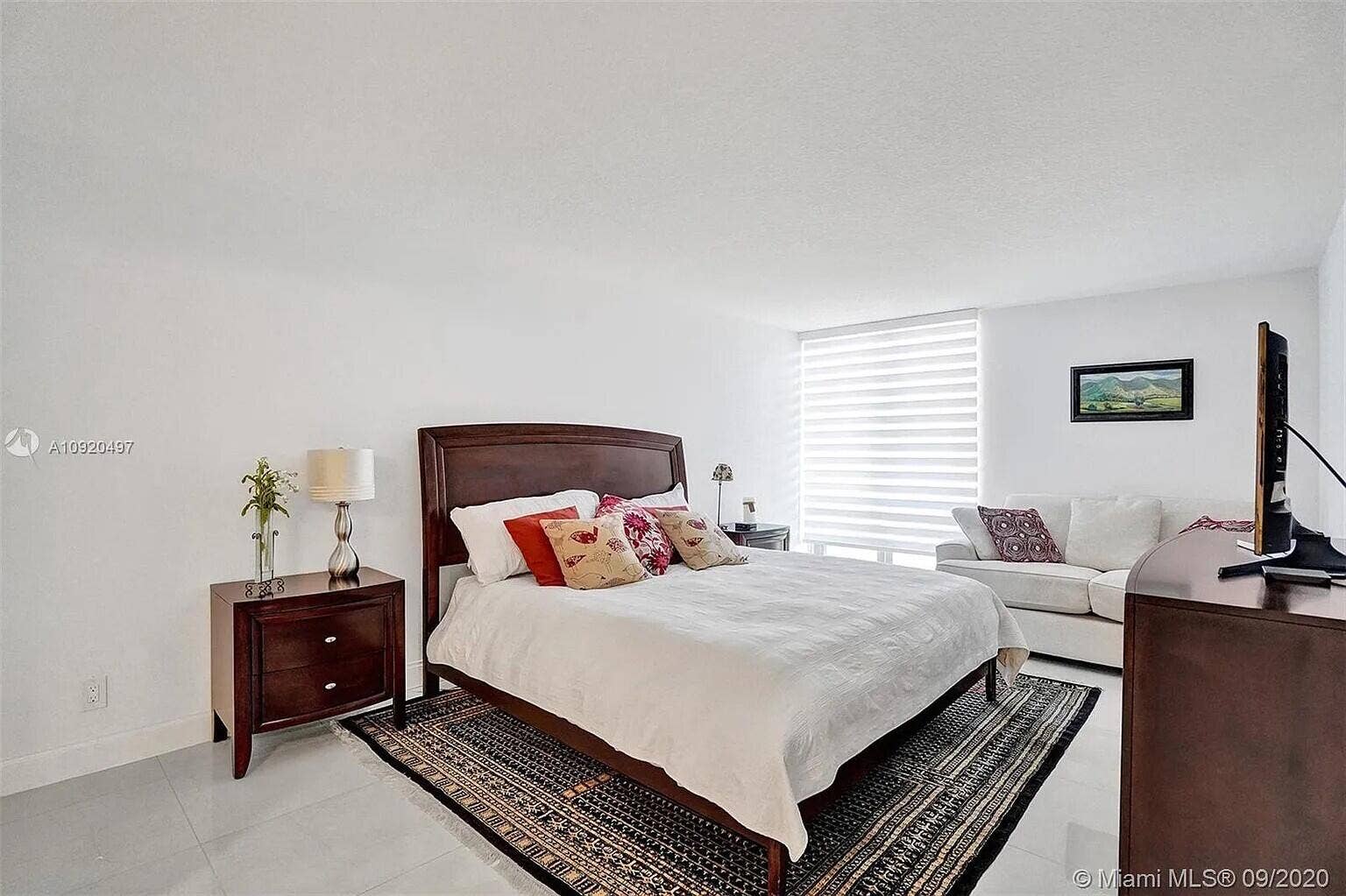 Large master ensuite with walk in closet with wall to wall shelves, drawers & hanging space.