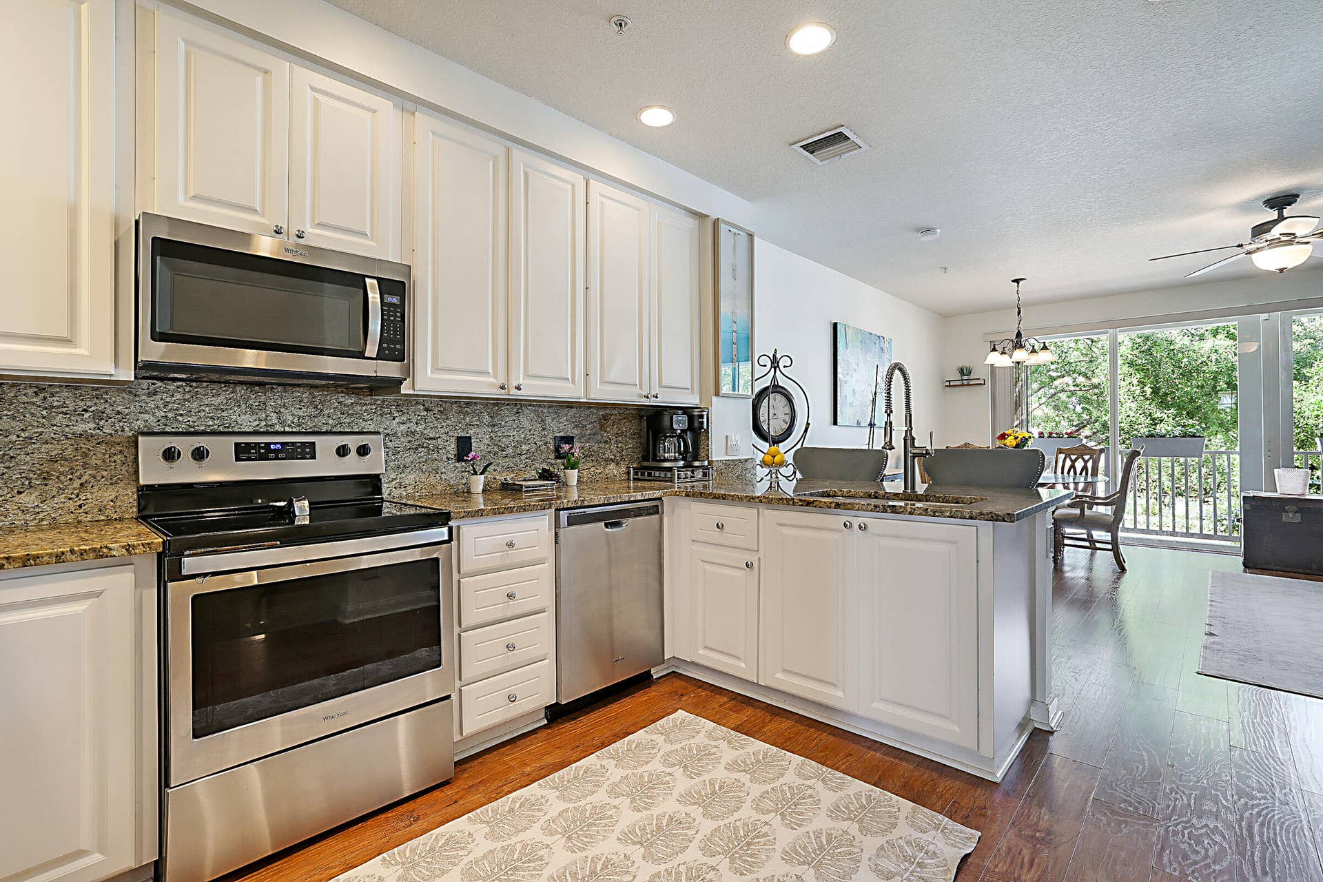 3414 W Mallory Boulevard, Jupiter, FL 33458 The flow from kitchen to living room works well.