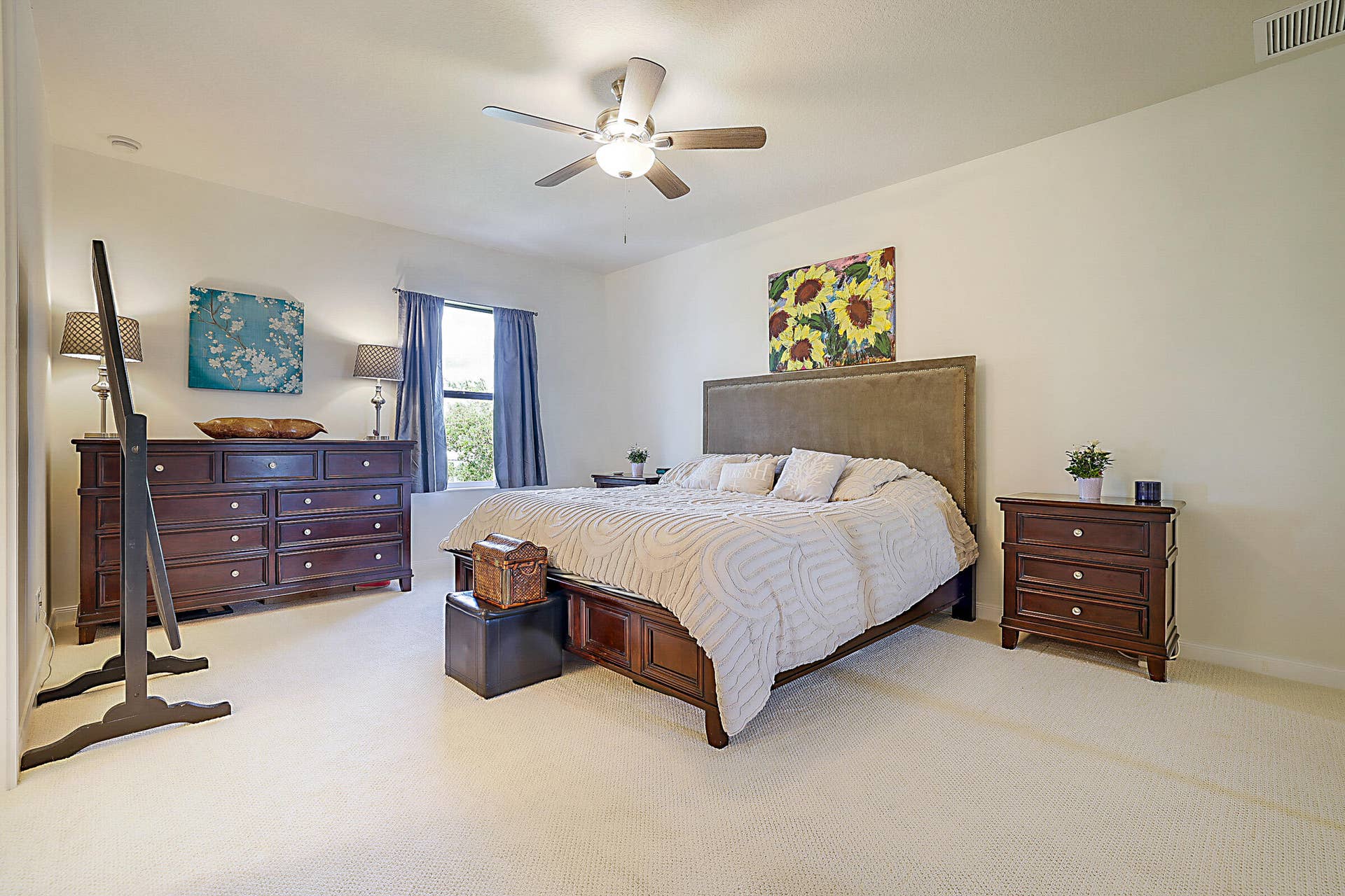 3414 W Mallory Boulevard, Jupiter, FL 33458 The large primary bedroom with it's ensuite bathroom and generous closet space