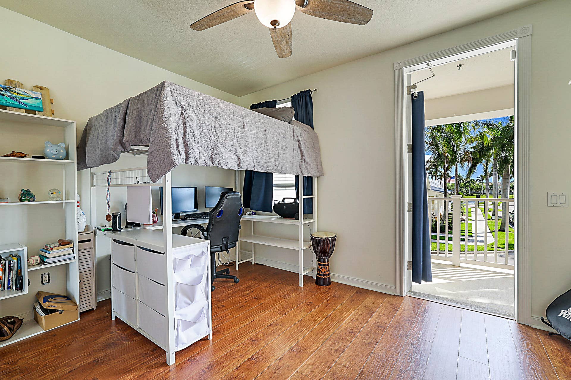3414 W Mallory Boulevard, Jupiter, FL 33458 Bedroom 2 with flexible use and direct access to a private balconyan uncommon bonus that adds privacy and outdoor living.