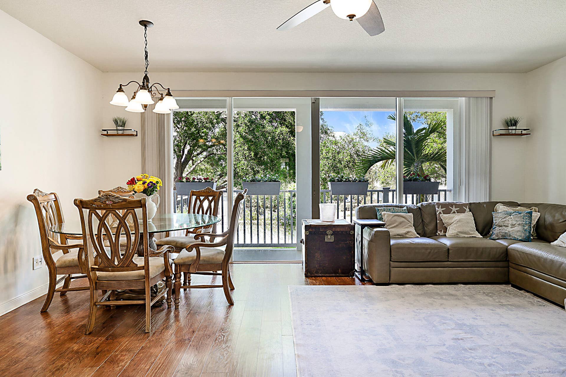 3414 W Mallory Boulevard, Jupiter, FL 33458 open-concept layout filled with natural light, thanks to oversized sliding glass doors that open onto a spacious balcony