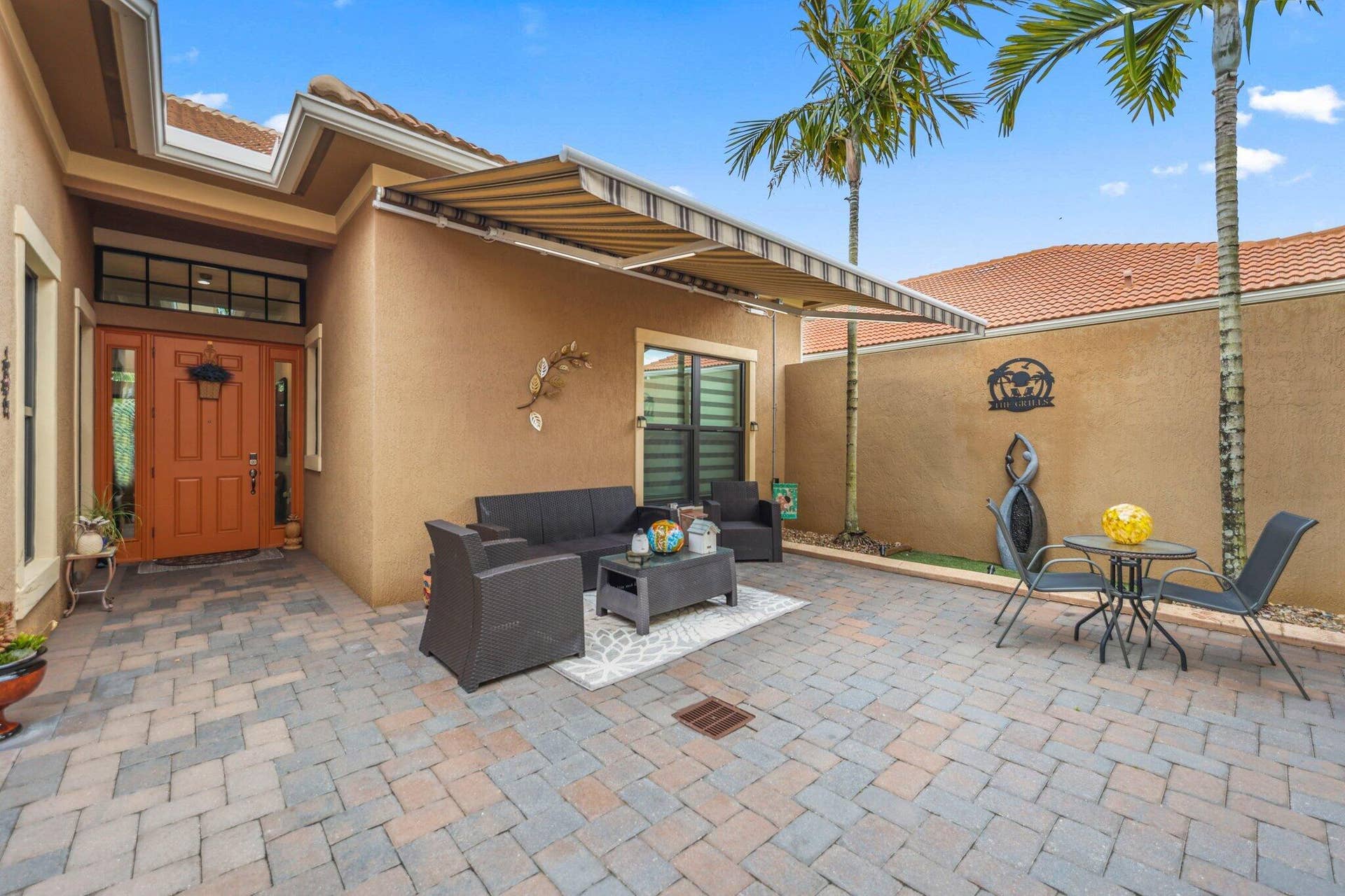 9368 Cantal Circle E, Parkland, FL 33076 Courtyard with Shade Awning