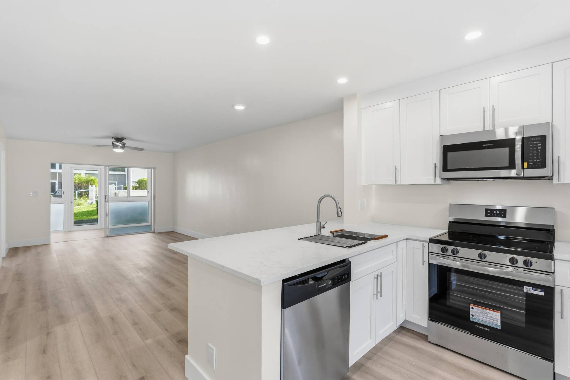 A brand NEW custom kitchen with quartz countertops, Eat in Bar, soft-close cabinets, stainless-steel appliances and ALL NEW ELECTRIC, PLUMBING, AC, AND HWH!