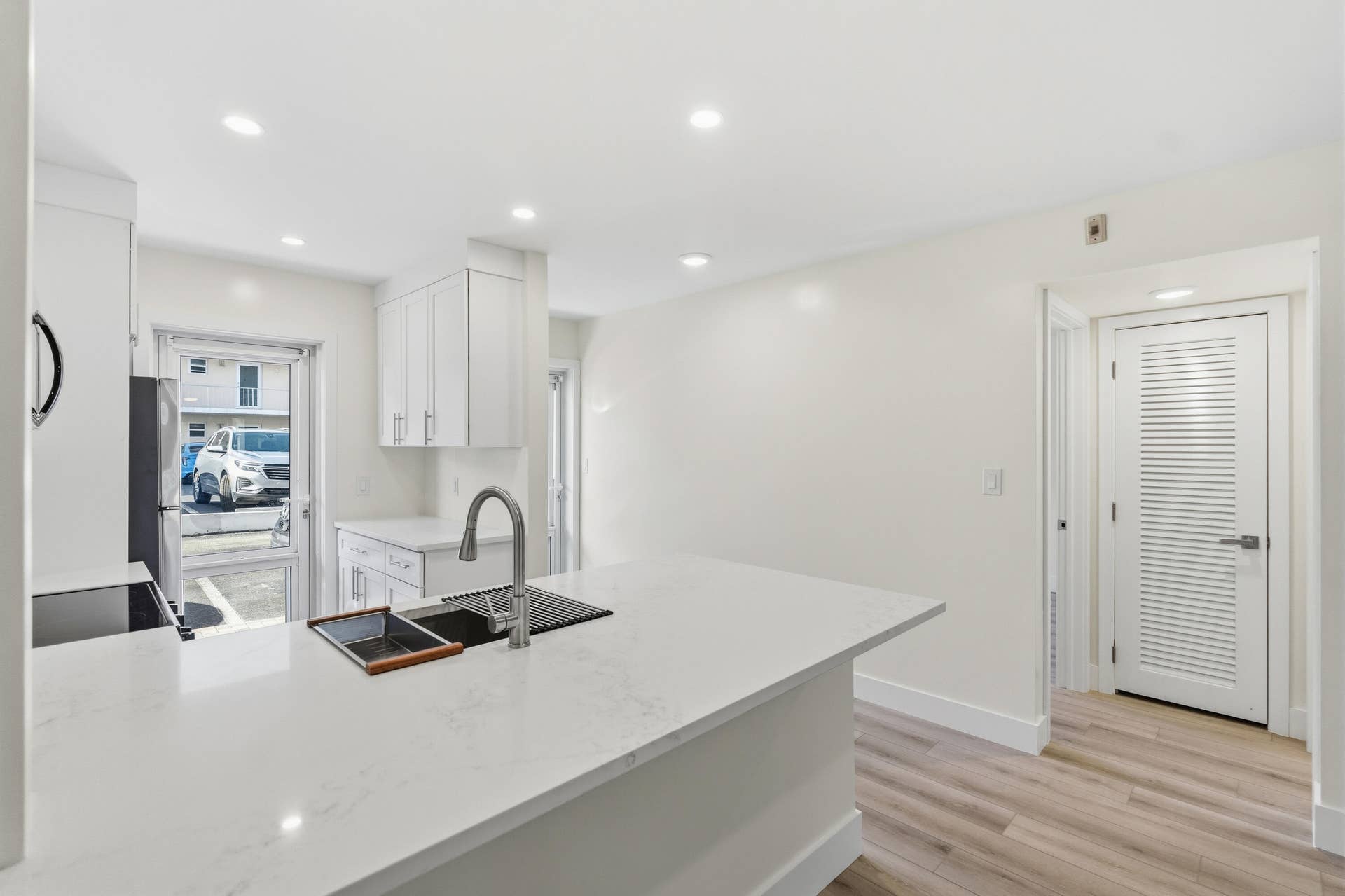 A brand NEW custom kitchen with quartz countertops, Eat in Bar, soft-close cabinets, stainless-steel appliances and ALL NEW ELECTRIC, PLUMBING, AC, AND HWH!