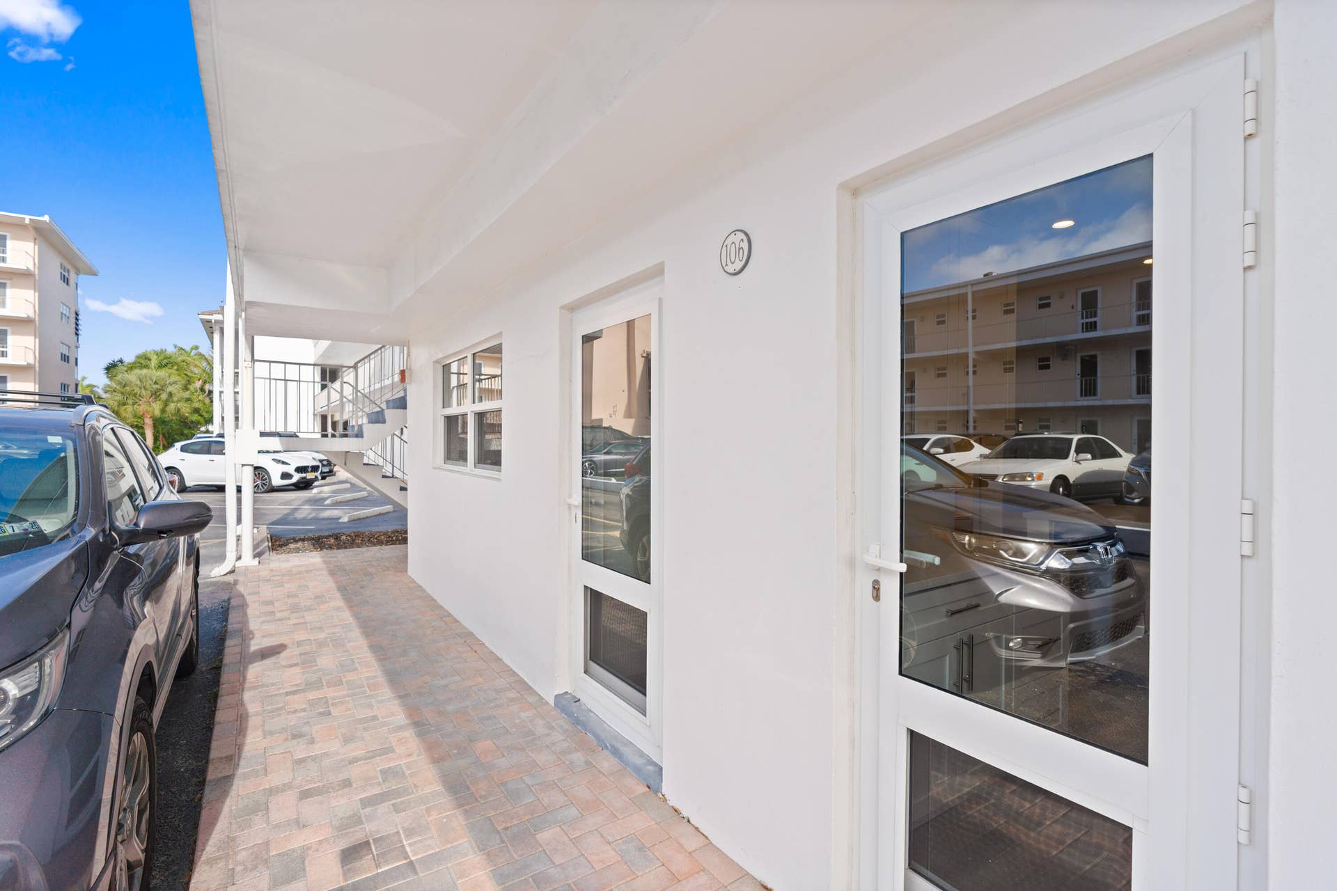 UNIT ENTRANCE WITH PARKING SPACE RIGHT OUT SIDE YOUR DOOR