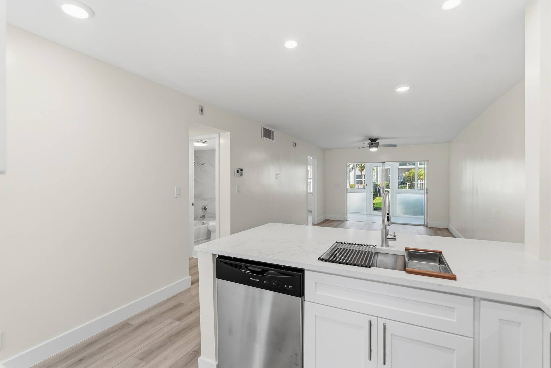 A brand NEW custom kitchen with quartz countertops, Eat in Bar, soft-close cabinets, stainless-steel appliances and ALL NEW ELECTRIC, PLUMBING, AC, AND HWH!
