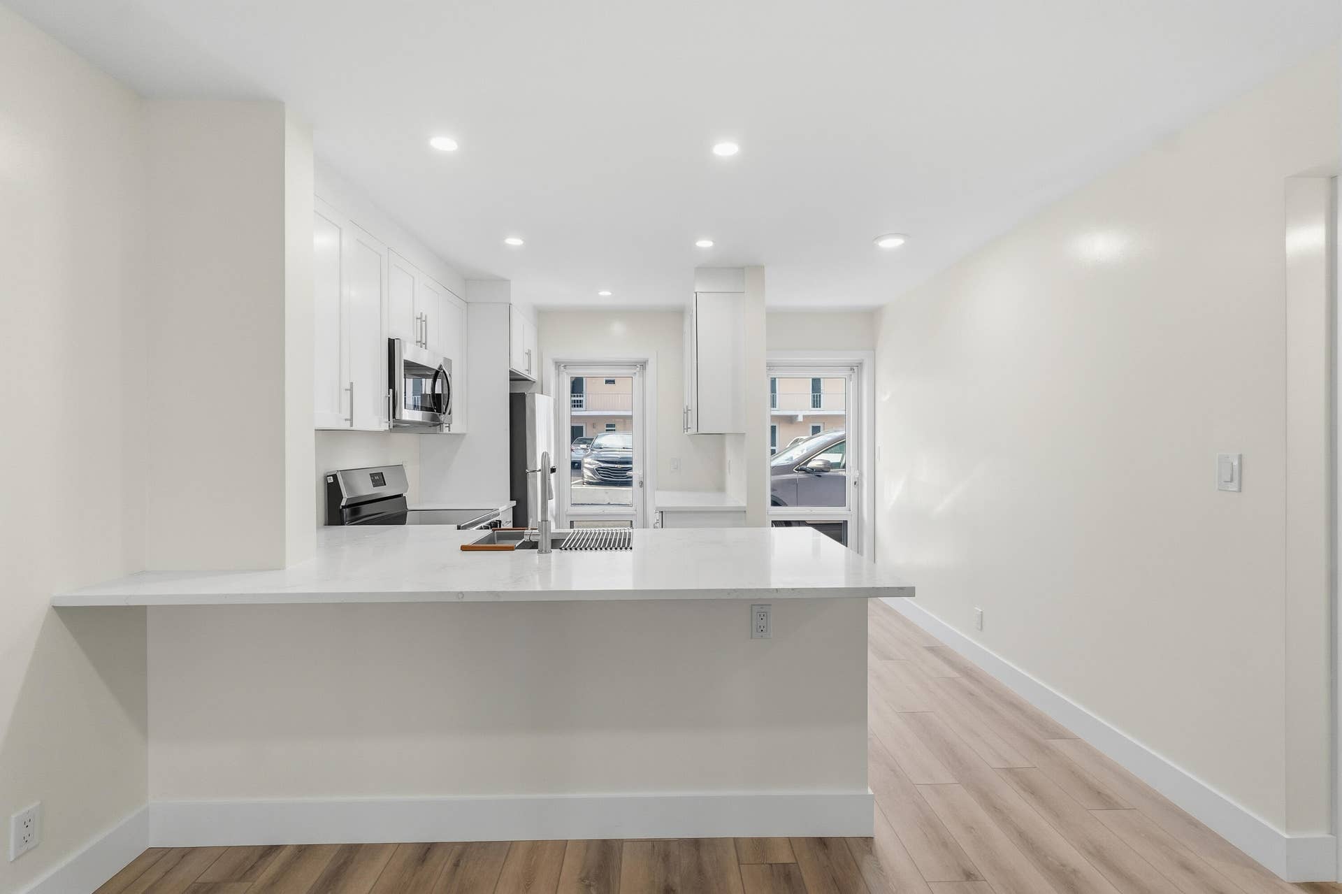 A brand NEW custom kitchen with quartz countertops, Eat in Bar, soft-close cabinets, stainless-steel appliances and ALL NEW ELECTRIC, PLUMBING, AC, AND HWH!